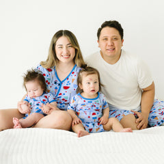 family of four wearing matching Stars, Stripes, and Sweets pj sets