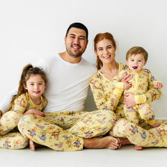 Family of four wearing matching Playtime with Pooh matching pjs