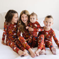 Children in matching pajamas in the Harry Potter Wizarding World print.