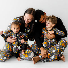Family wearing matching Hey Boo printed pajamas