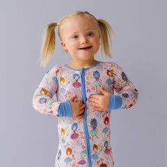 Image of a toddler girl wearing long sleeve zipper romper pajamas in Prima Ballerina print.
