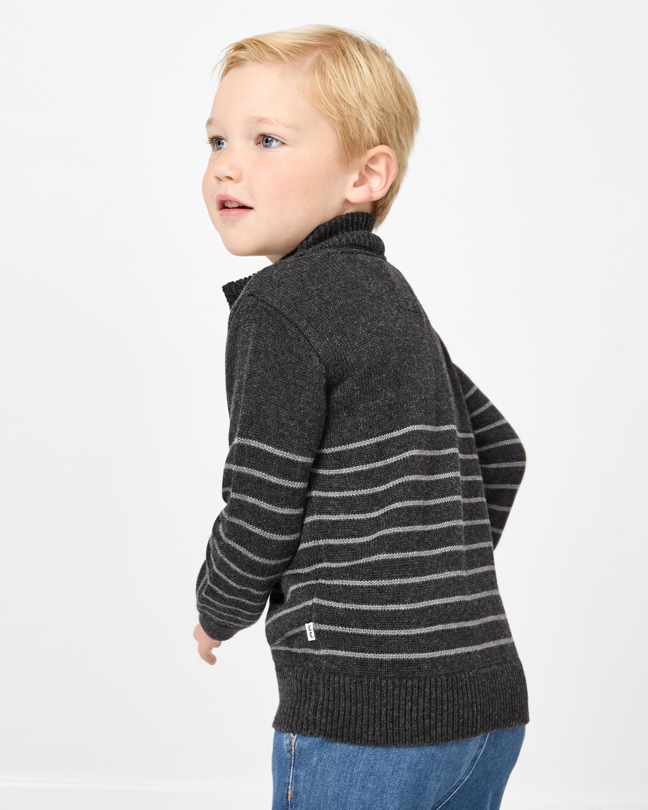 Close up of boy wearing the Charcoal Stripes Zip Sweater