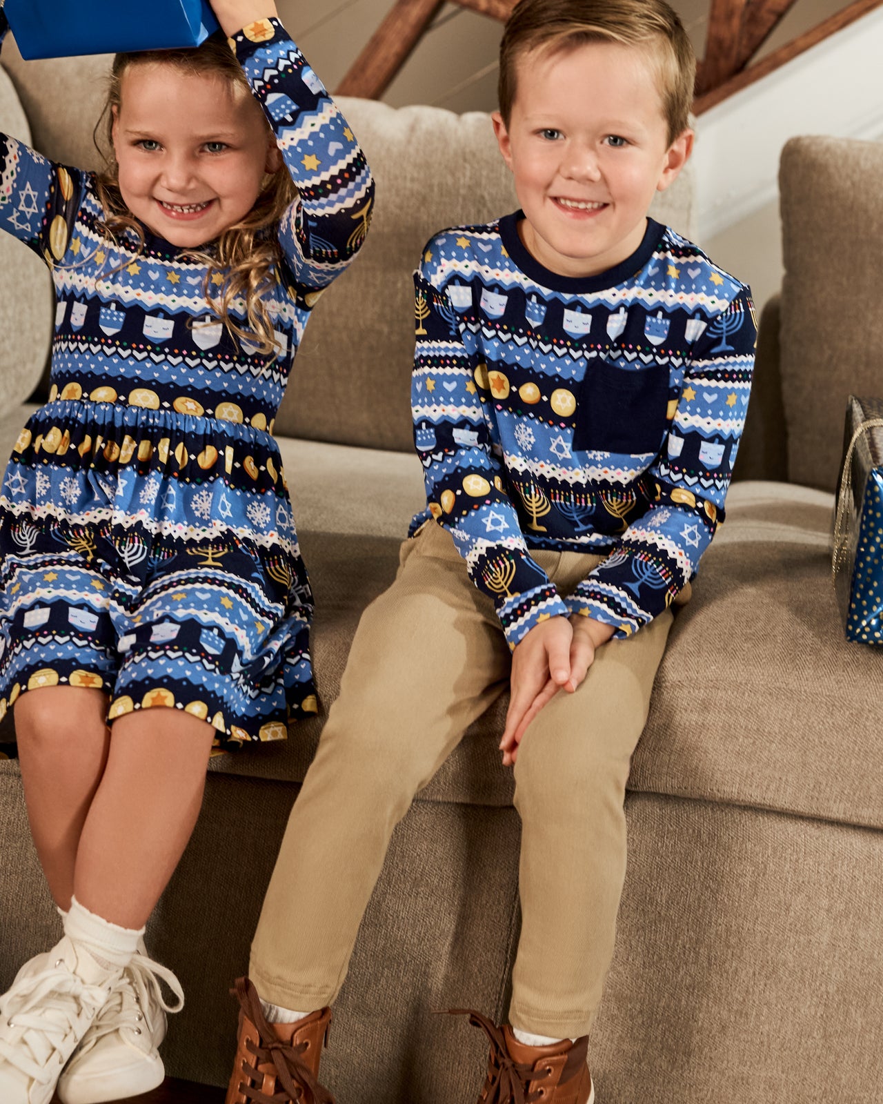Boy and girl wearing matching Hanukkah Fair Isle play styles