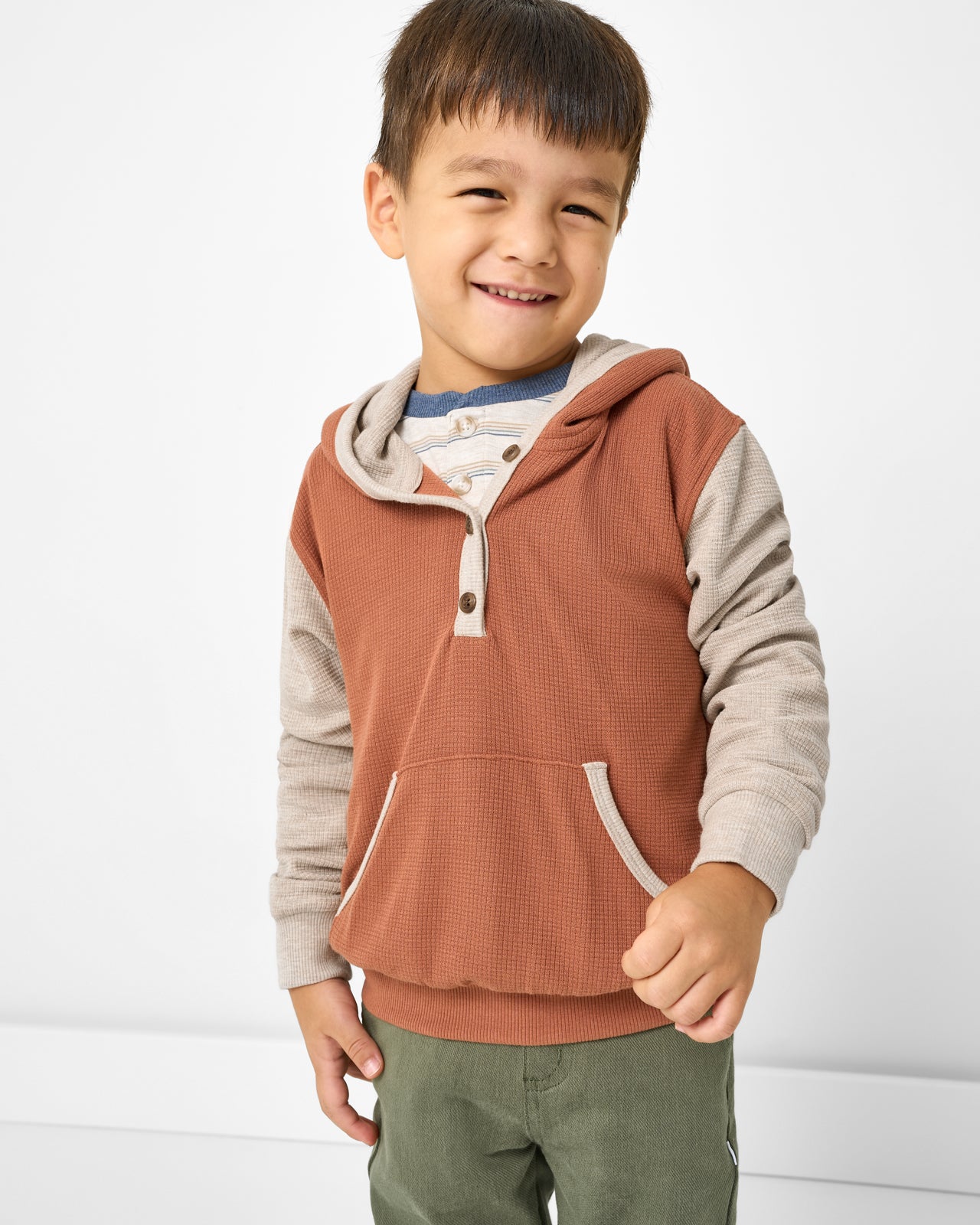 Boy wearing the Autumn Spice Waffle Henley Hoodie