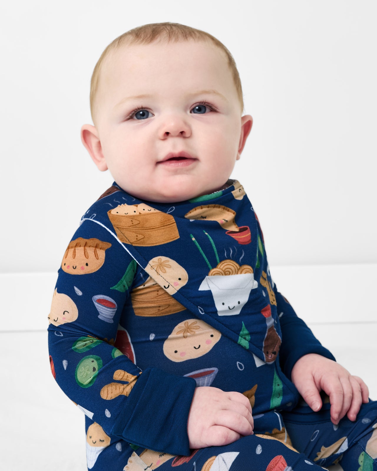 Baby wearing the Bao Buddies Bandana Bib