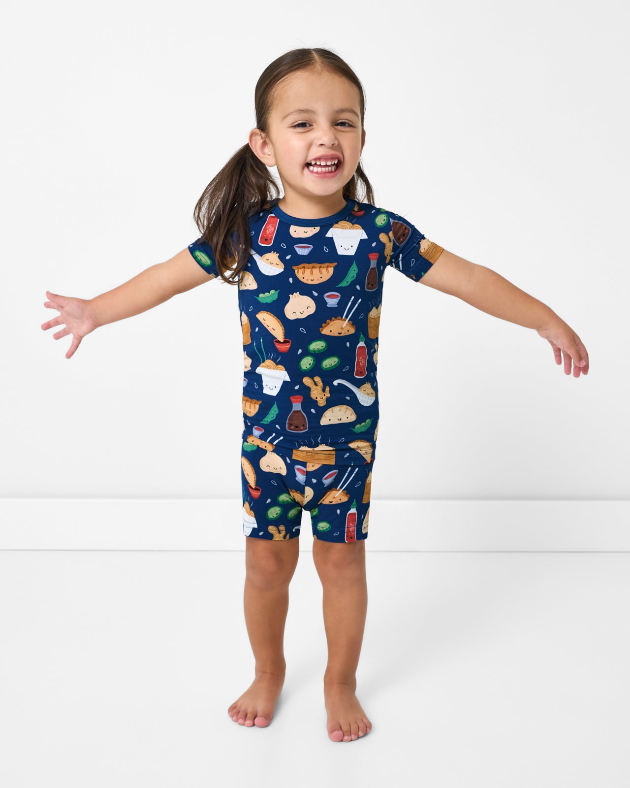Posing girl wearing the Bao Buddies Two-Piece Short Sleeve & Shorts Pajama Set
