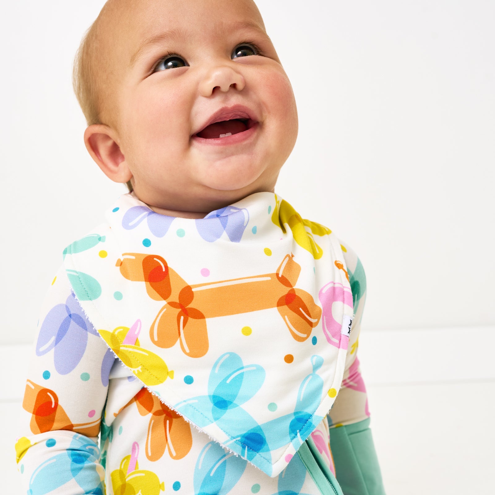 Close up of child wearing the Balloon Bash Bandana Bib