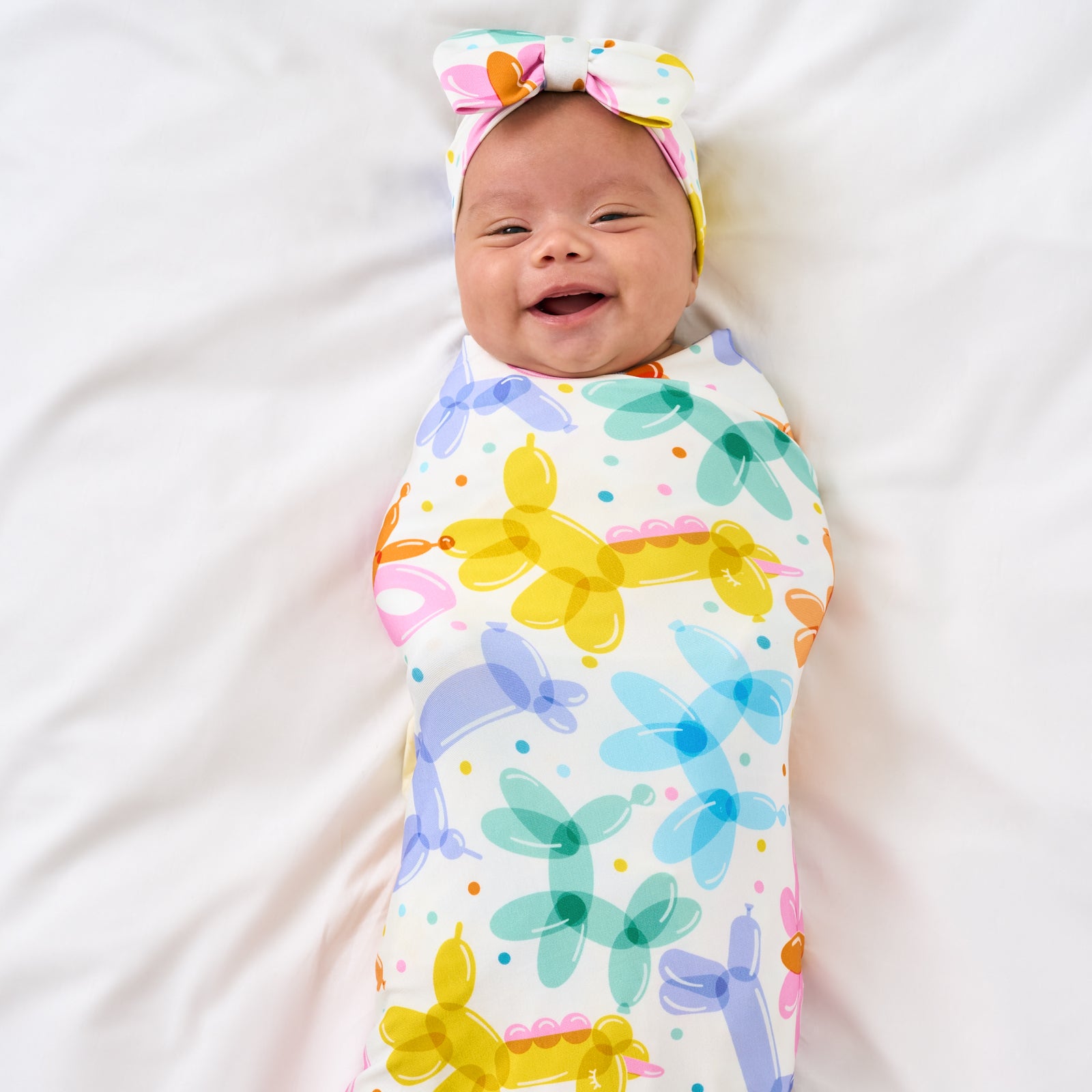 Aerial photo of child Balloon Bash luxe bow headband