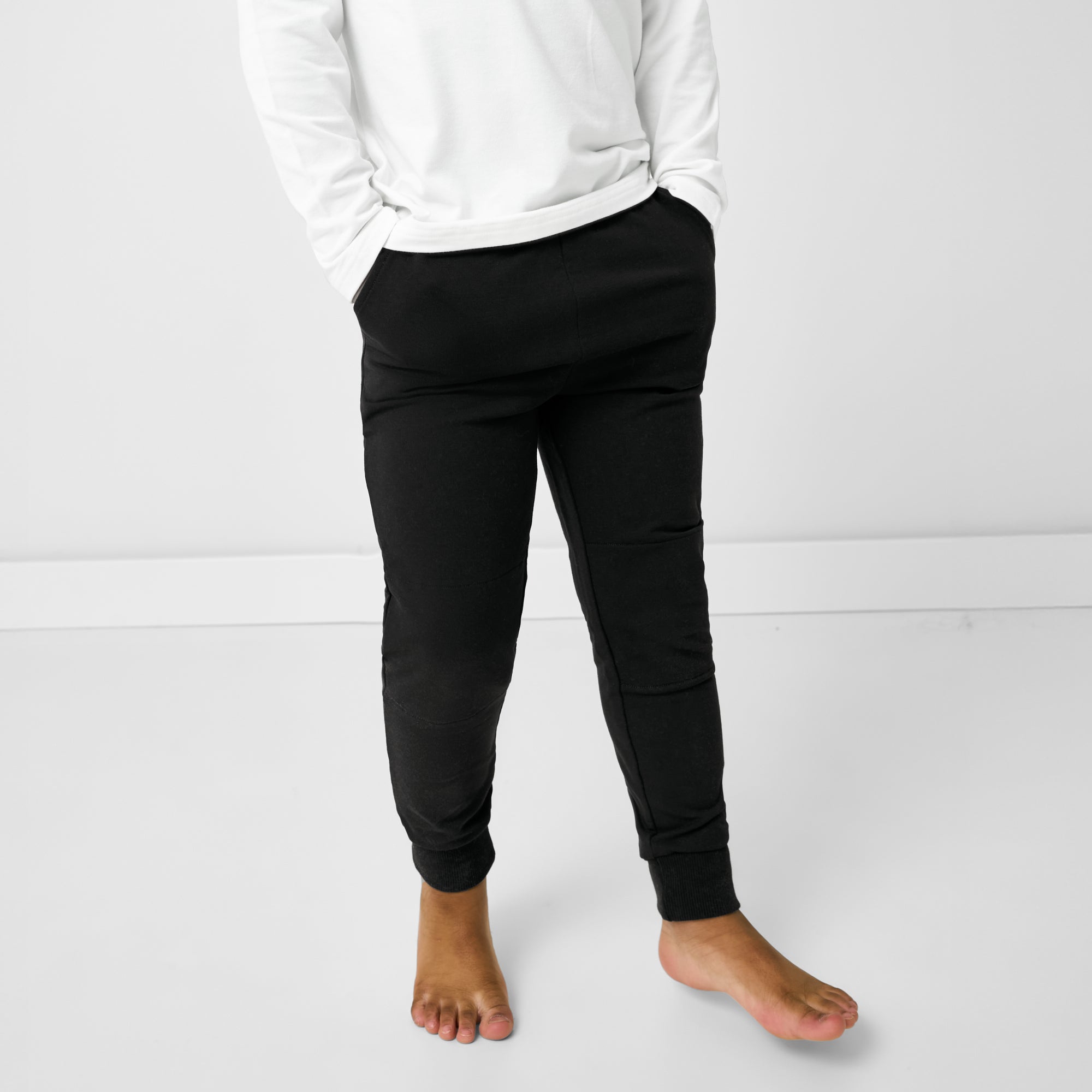 Close up of standing child wearing the Black Jogger