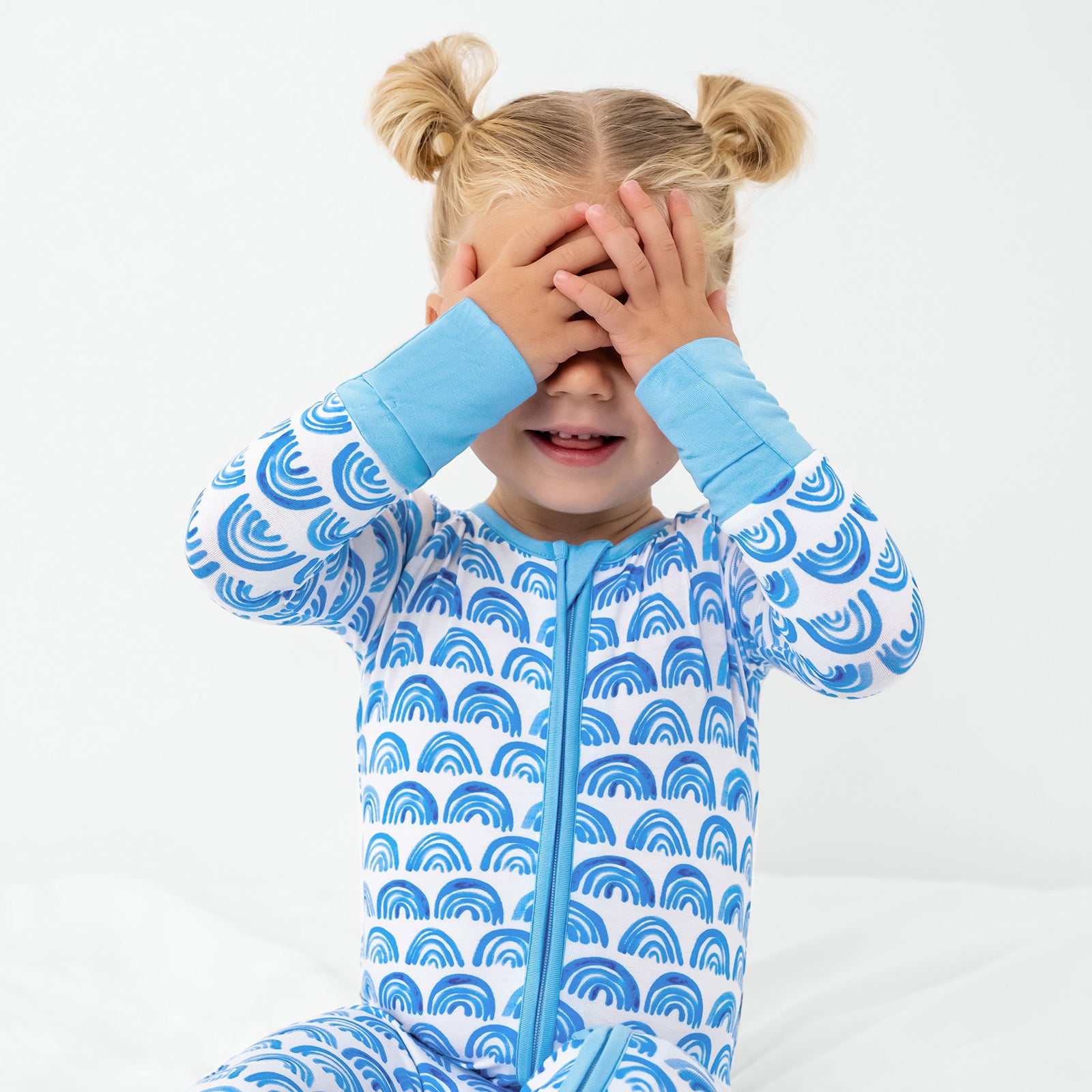 Posing child wearing the Blue Rainbows Zippy