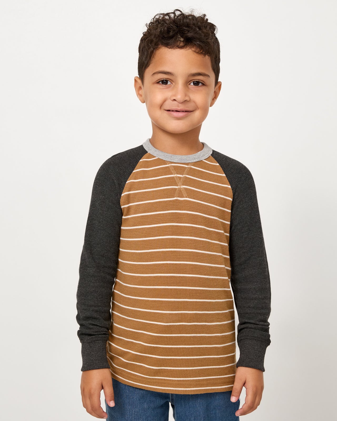 Boy wearing the Cider Stripe Waffle Raglan Tee