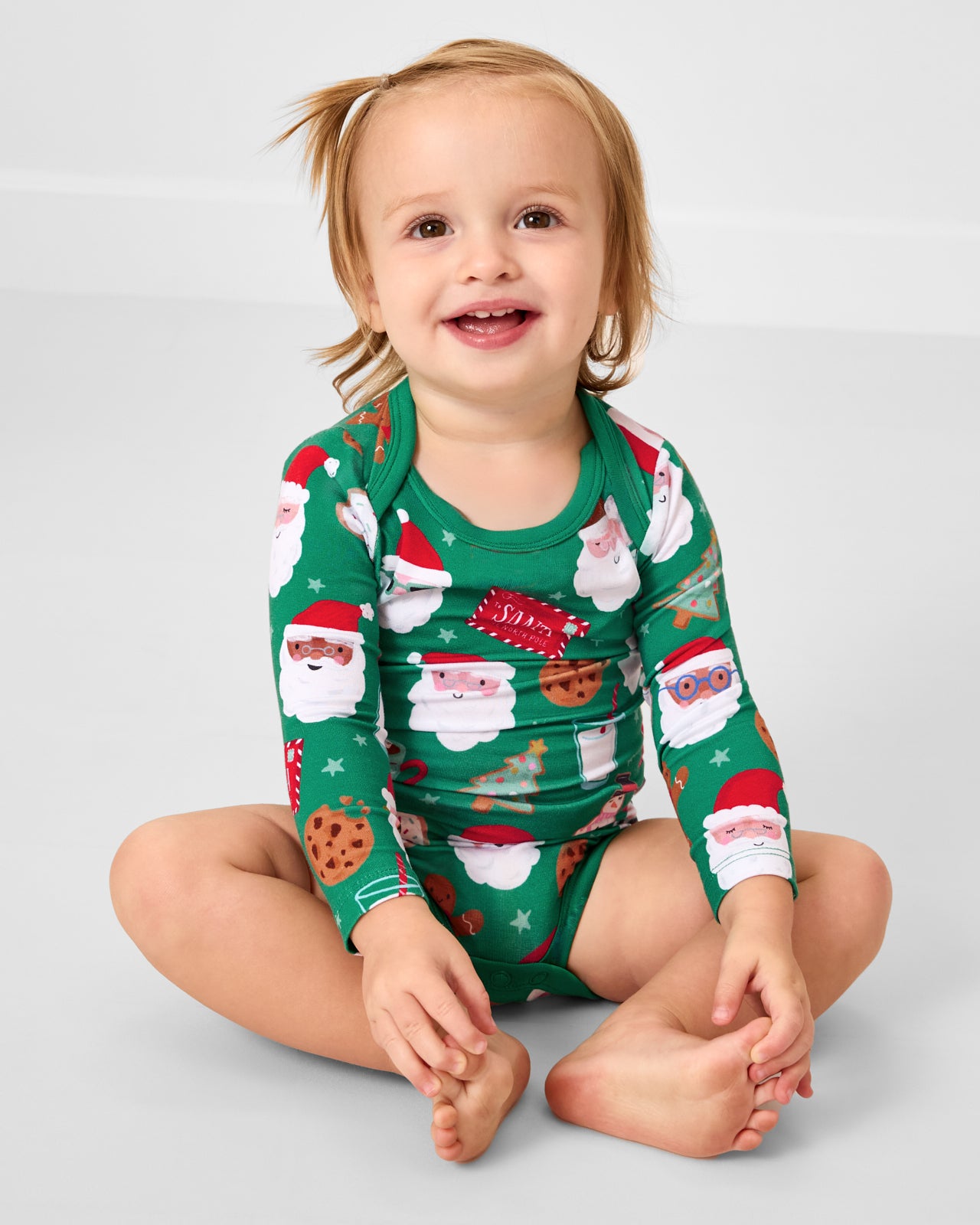 Sitting baby wearing the Cookies for Santa Bodysuit