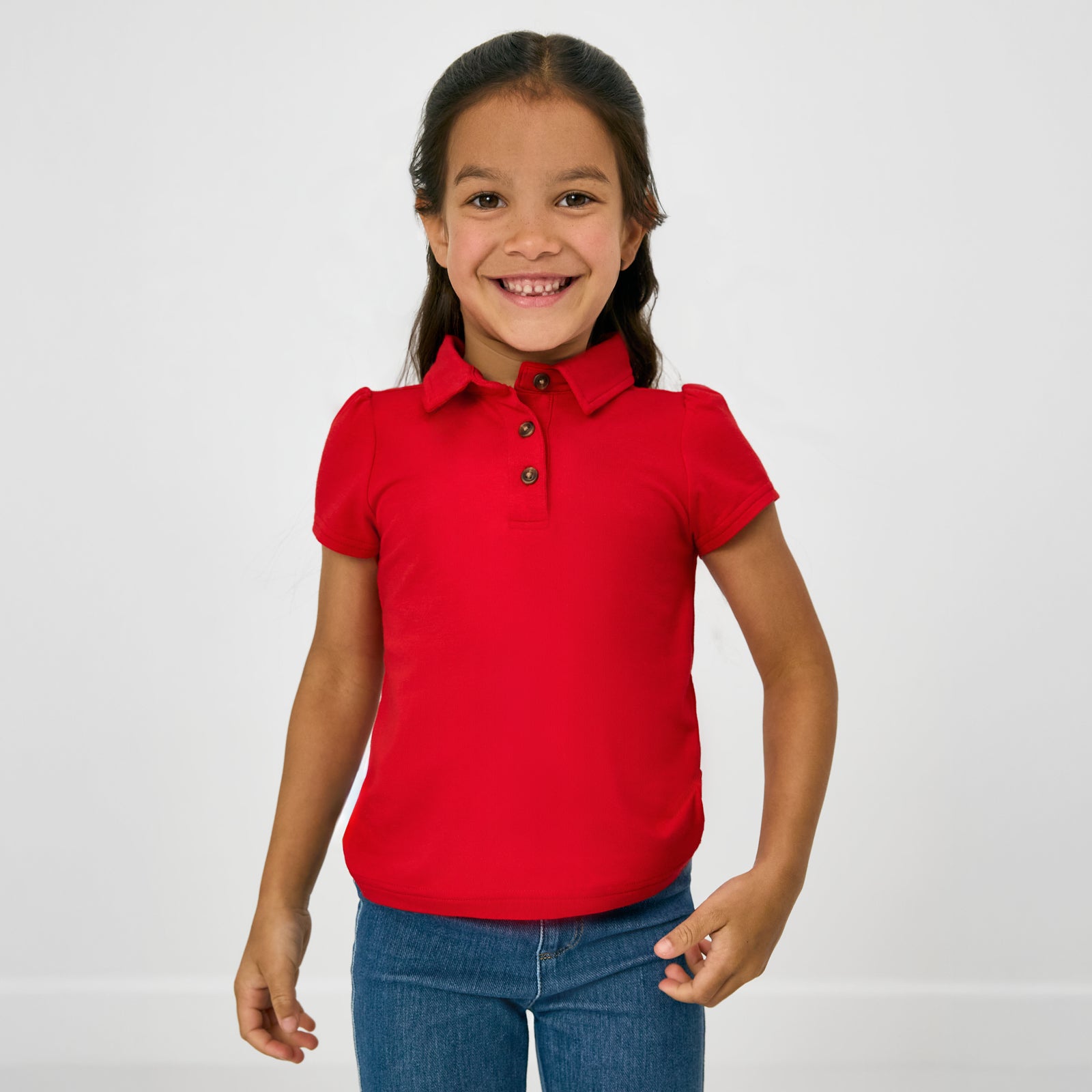 Standing child wearing the Candy Red Puff Sleeve Polo
