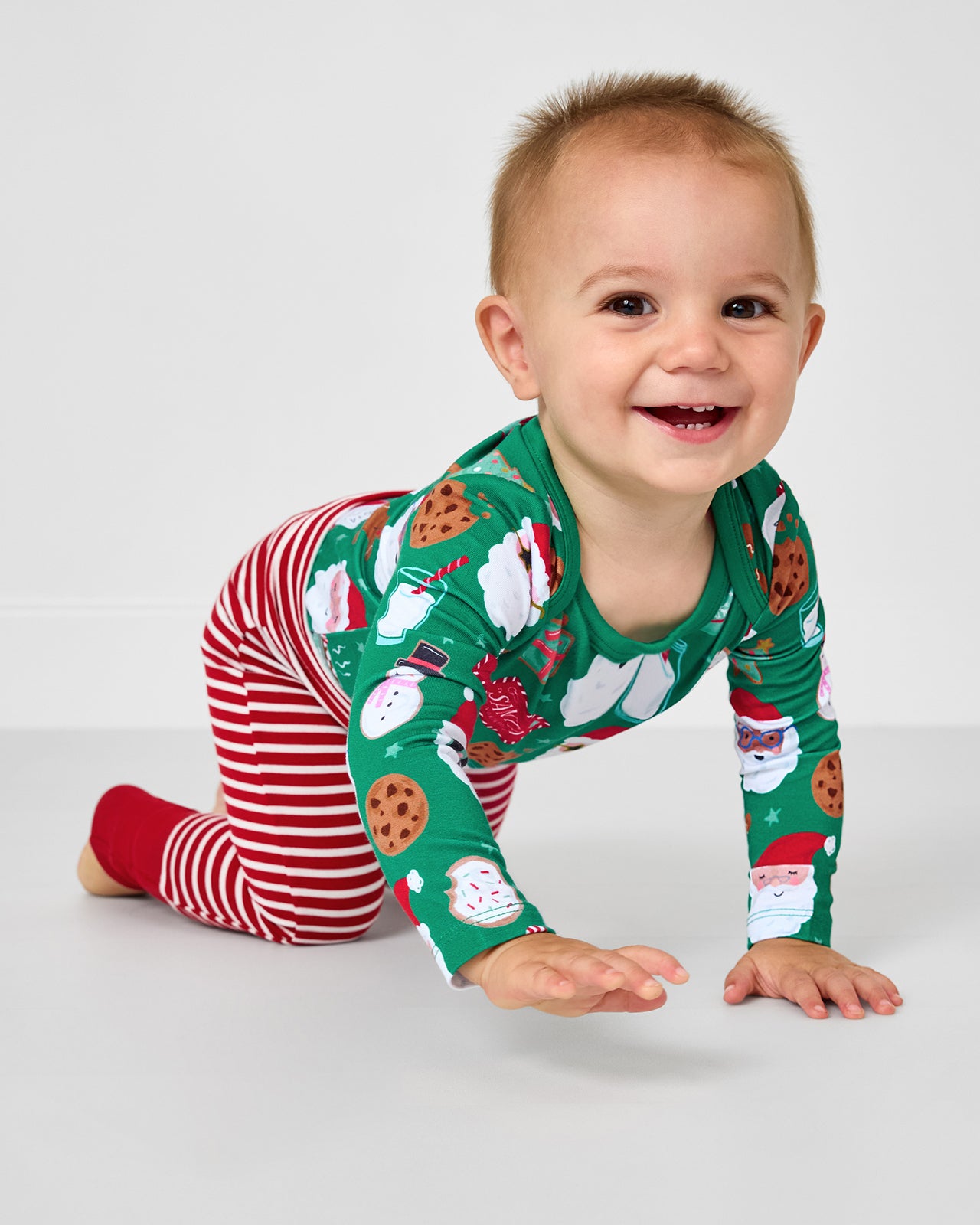 Crawling baby wearing the Candy Cane Stripe Fold-Over Legging