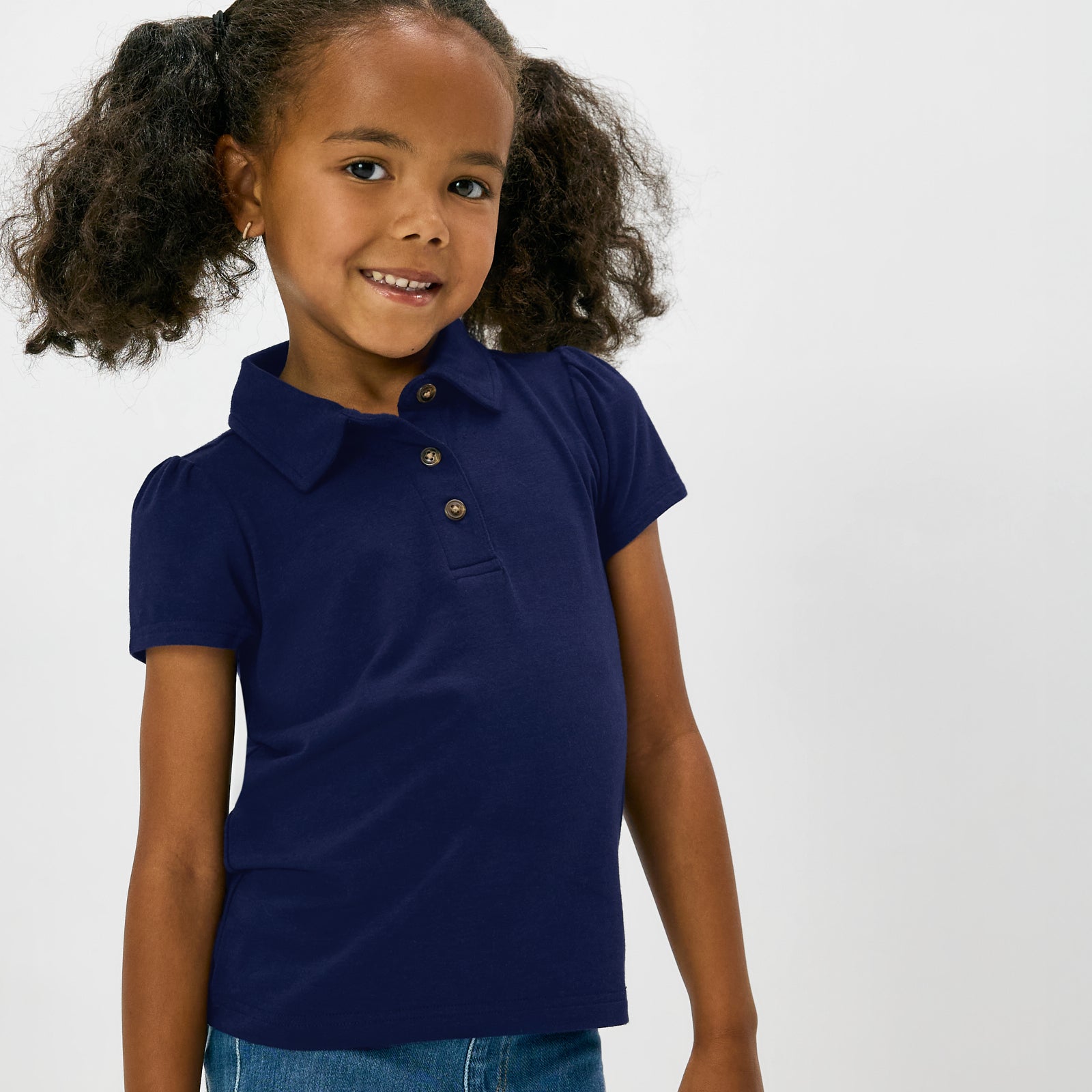 Close up of alternate child wearing the Classic Navy Puff Sleeve Polo