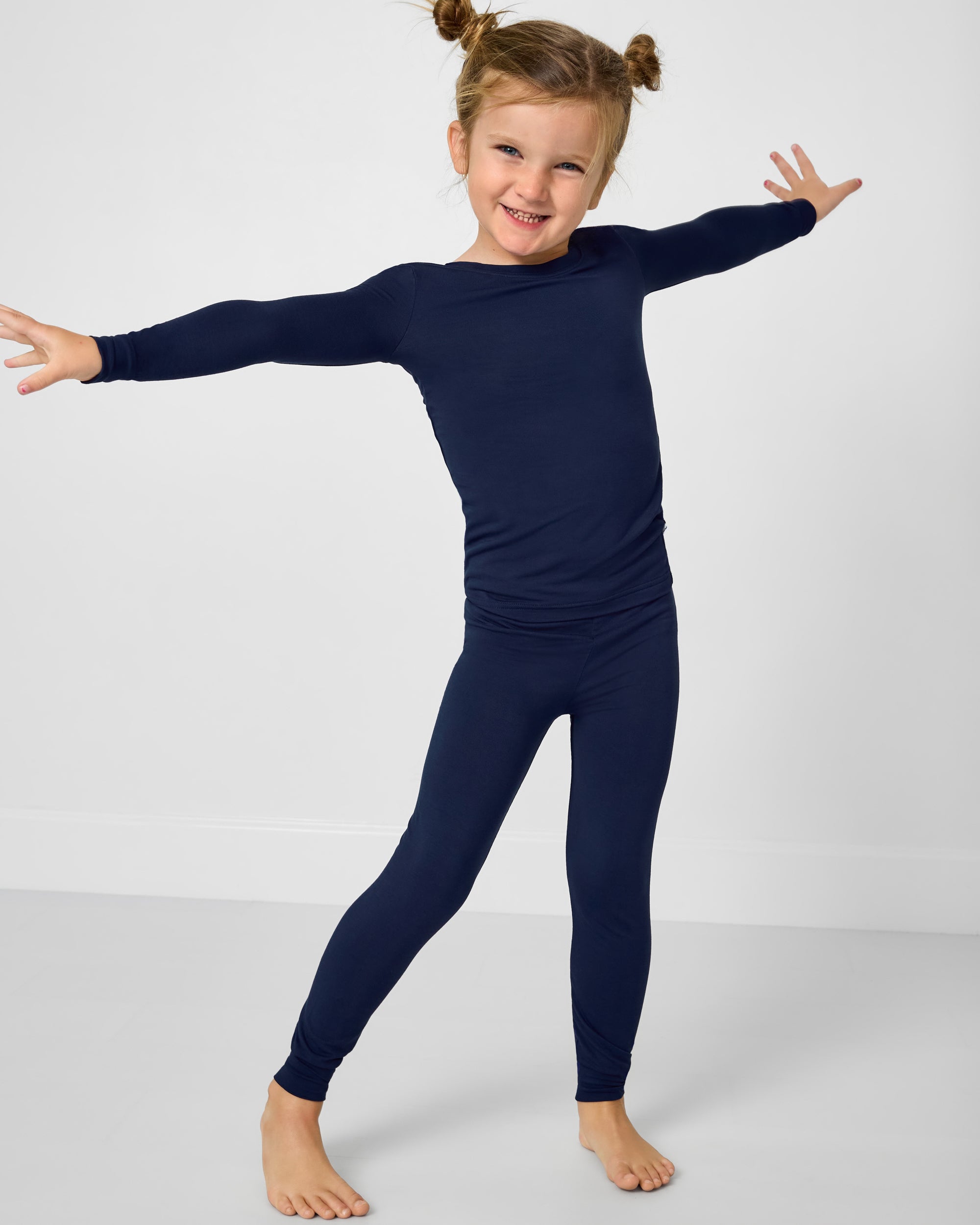 Posing girl wearing the Classic Navy Two-Piece Pajama Set