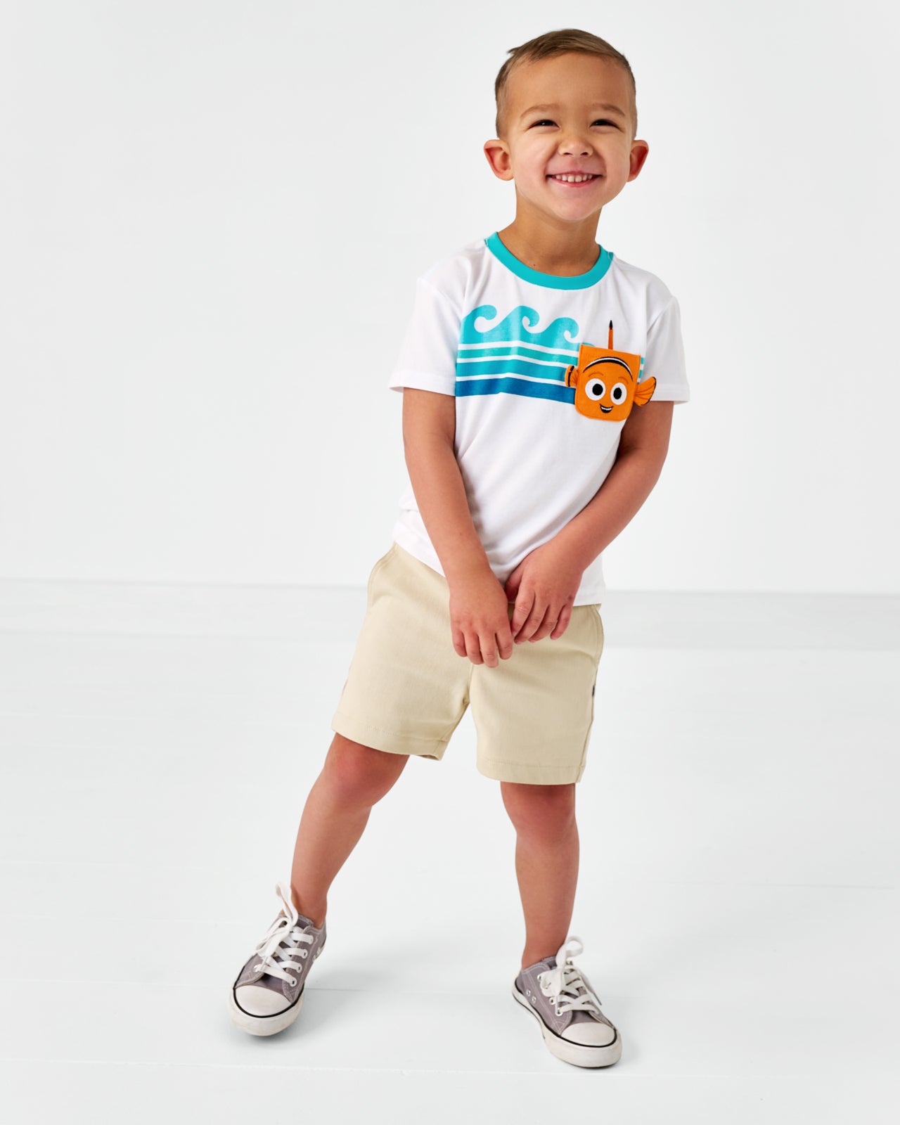 Standing child wearing the Disney Nemo Relaxed Bamboo Pocket Tee