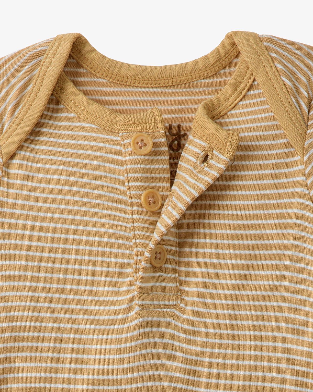 Close up of the button detail on the Hazel Wood Stripe Henley Bodysuit