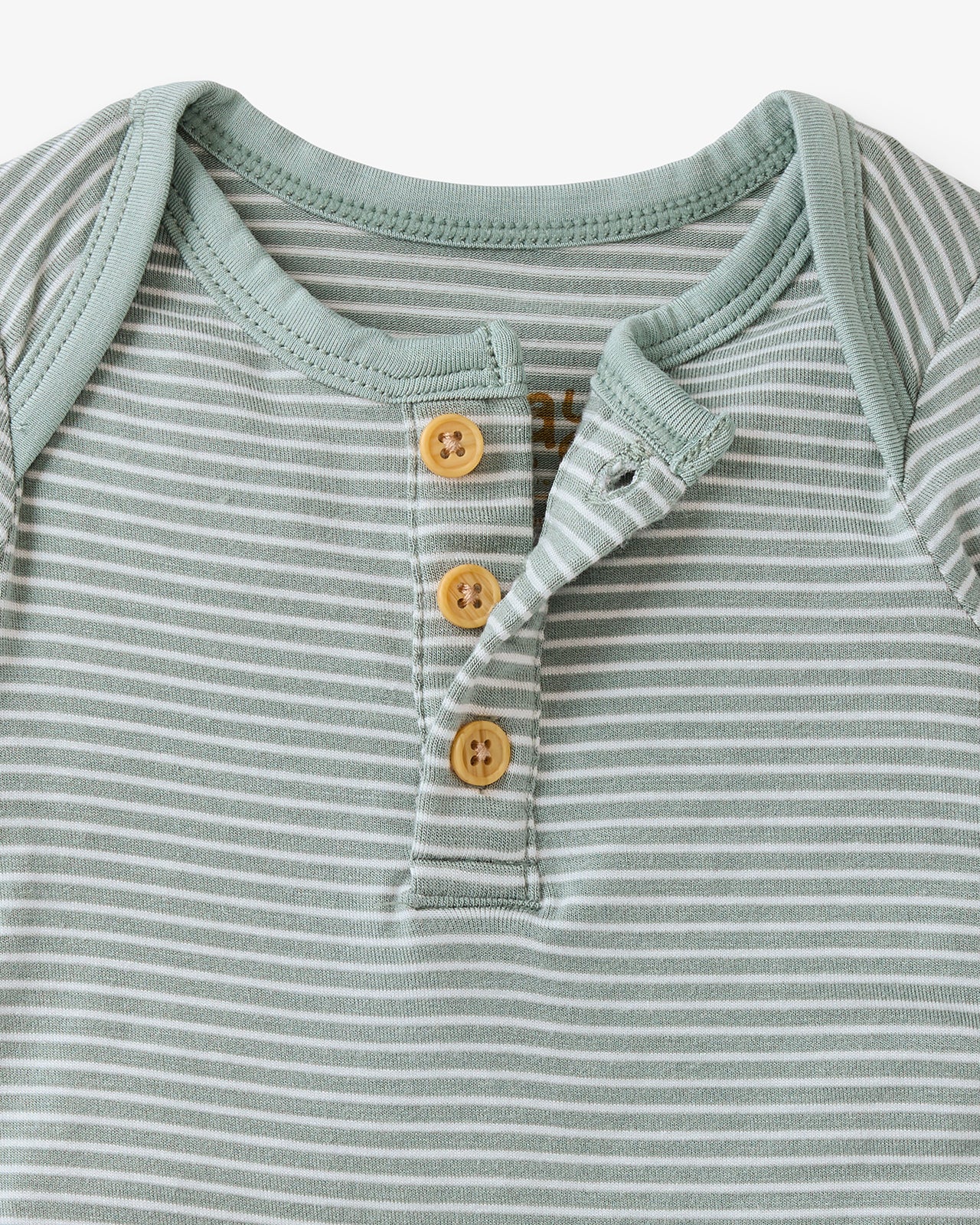 Close up flat lay of the button detail on the Willow Stripe Henley Bodysuit