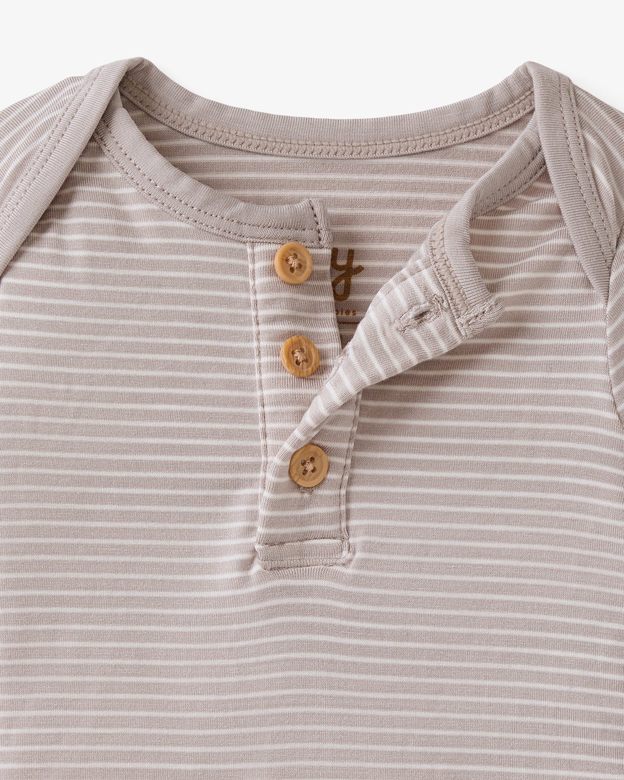 Close up flat lay of the button details on the Dove Gray Stripe Henley Bodysuit