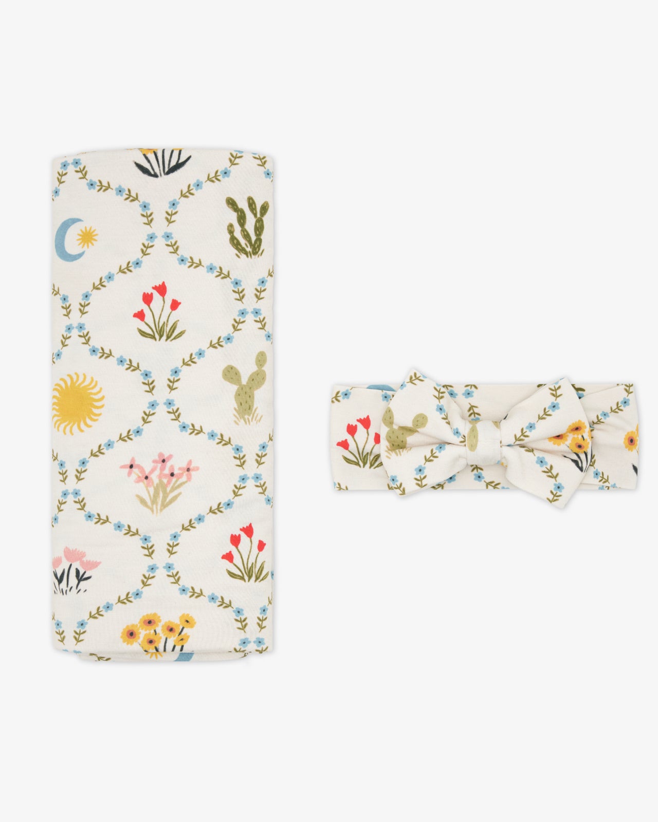 Flat lay of the Desert Meadow Swaddle & Luxe Bow Headband Set