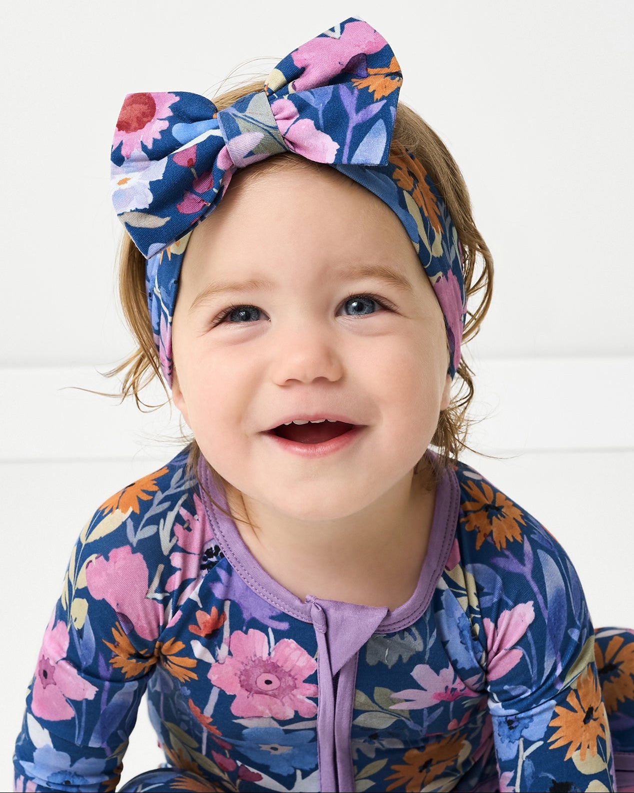 Child wearing the Dusk Blooms Luxe Bow Headband