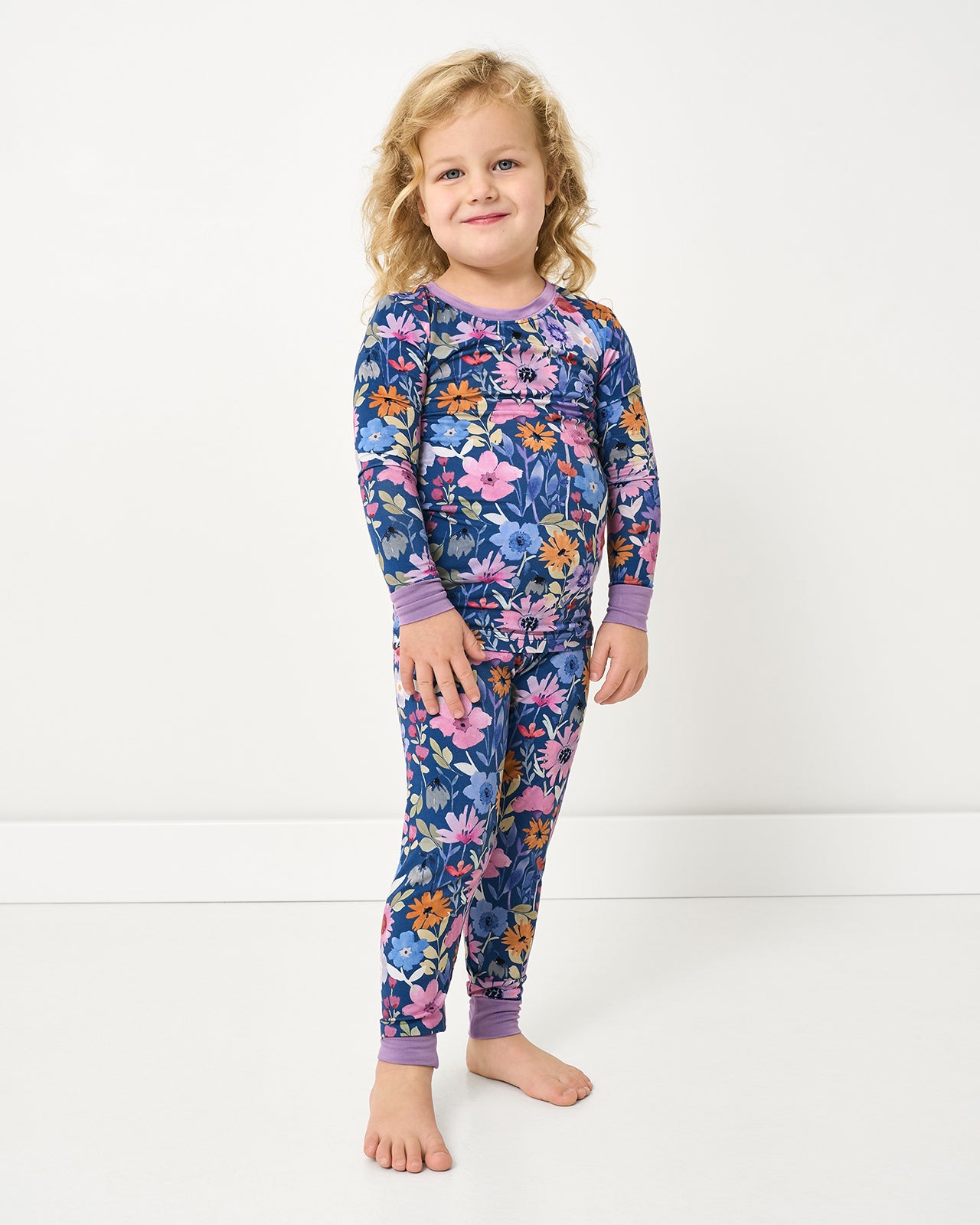 Standing girl wearing the Dusk Blooms Two-Piece Pajama Set