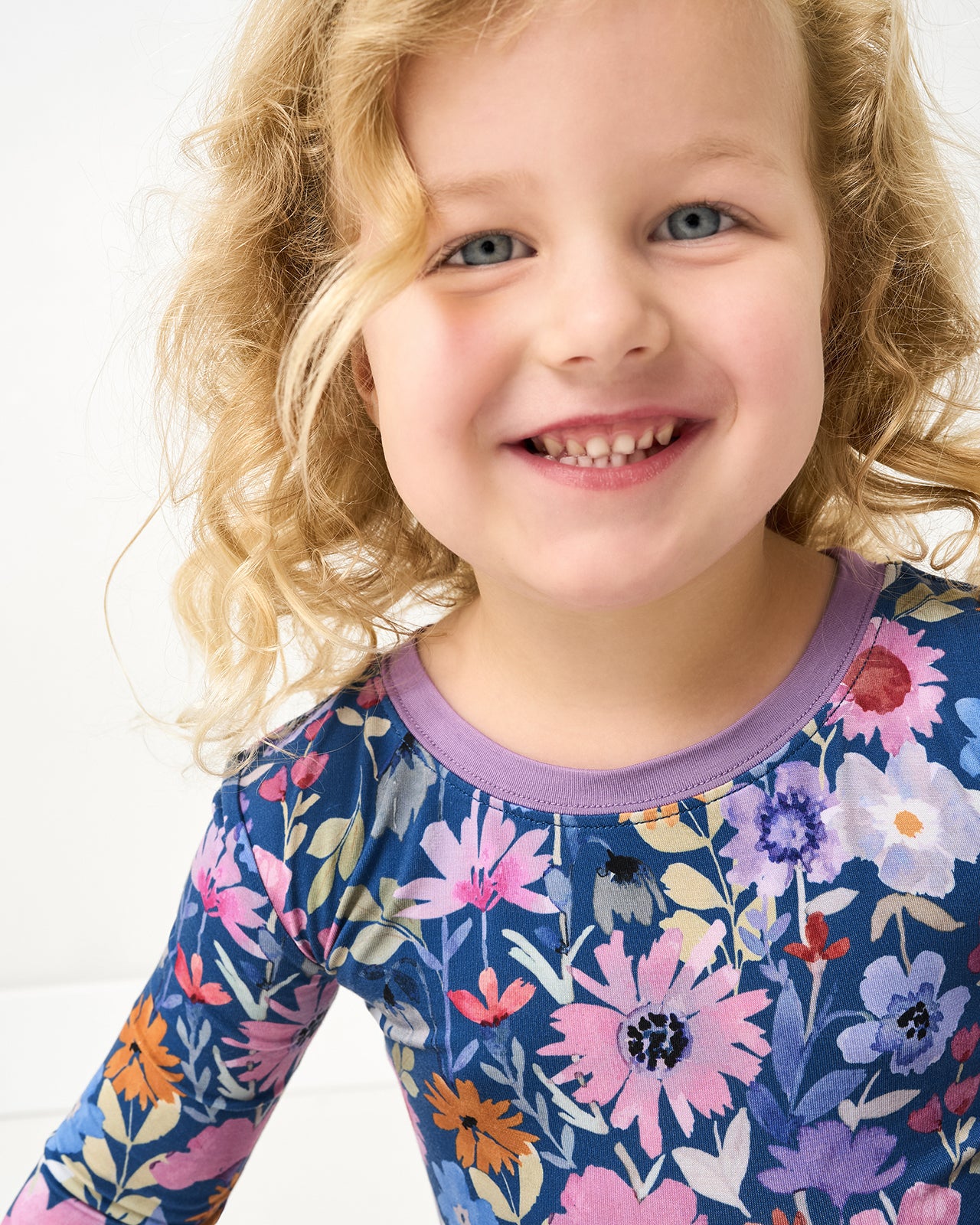 Close up of girl wearing the Dusk Blooms Two-Piece Pajama Set