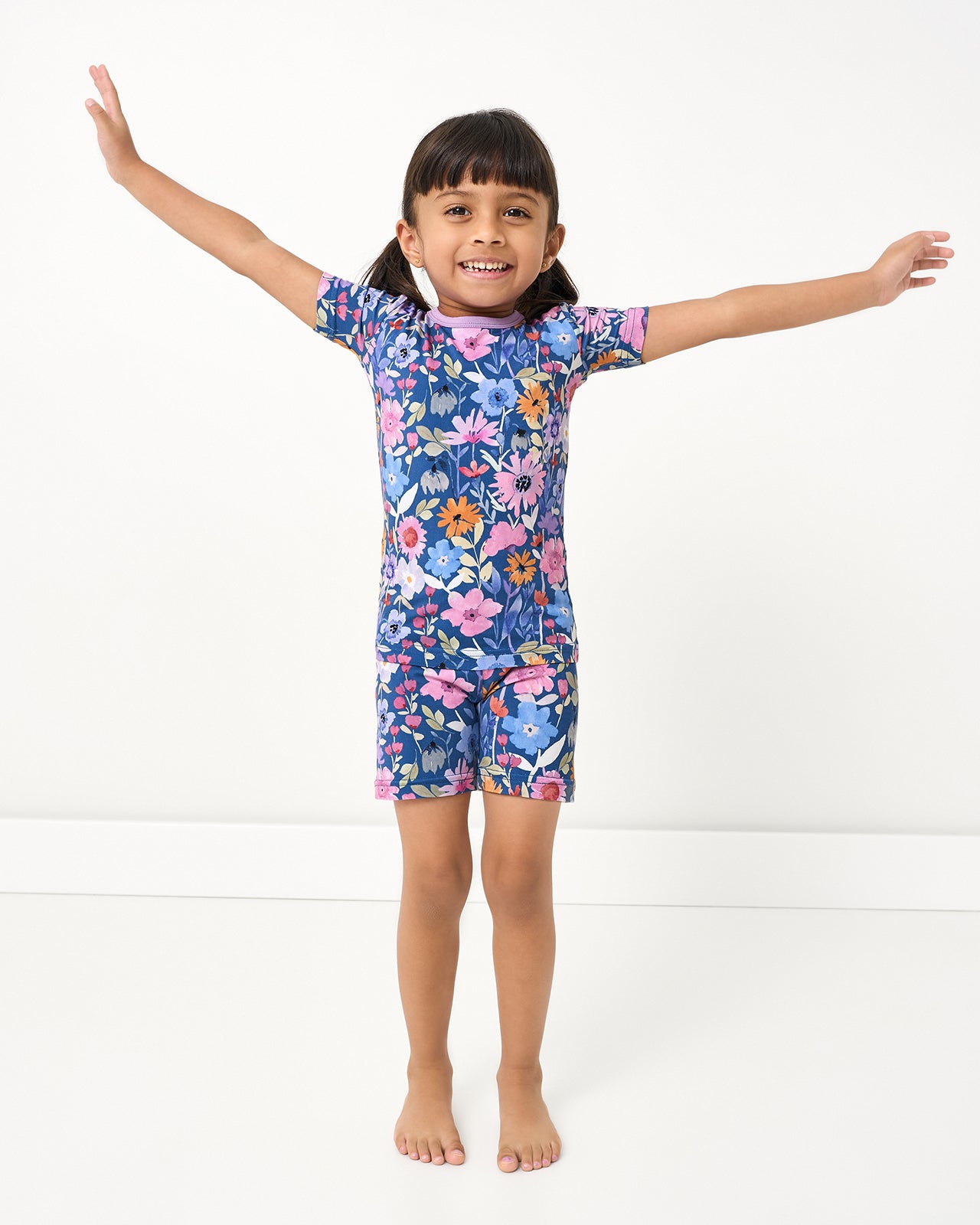 Posing girl wearing the Dusk Blooms Two-Piece Short Sleeve & Shorts Pajama Set