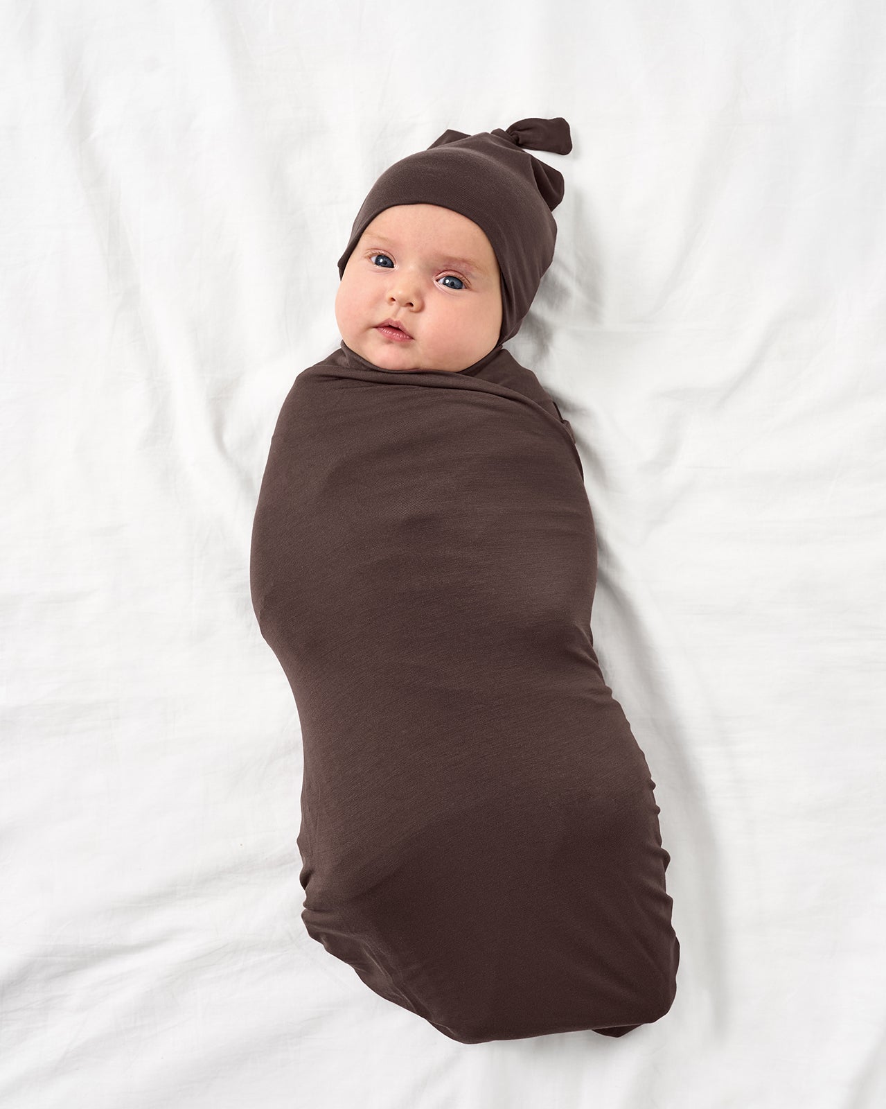Baby in Dark Chocolate Swaddle & Hat set.