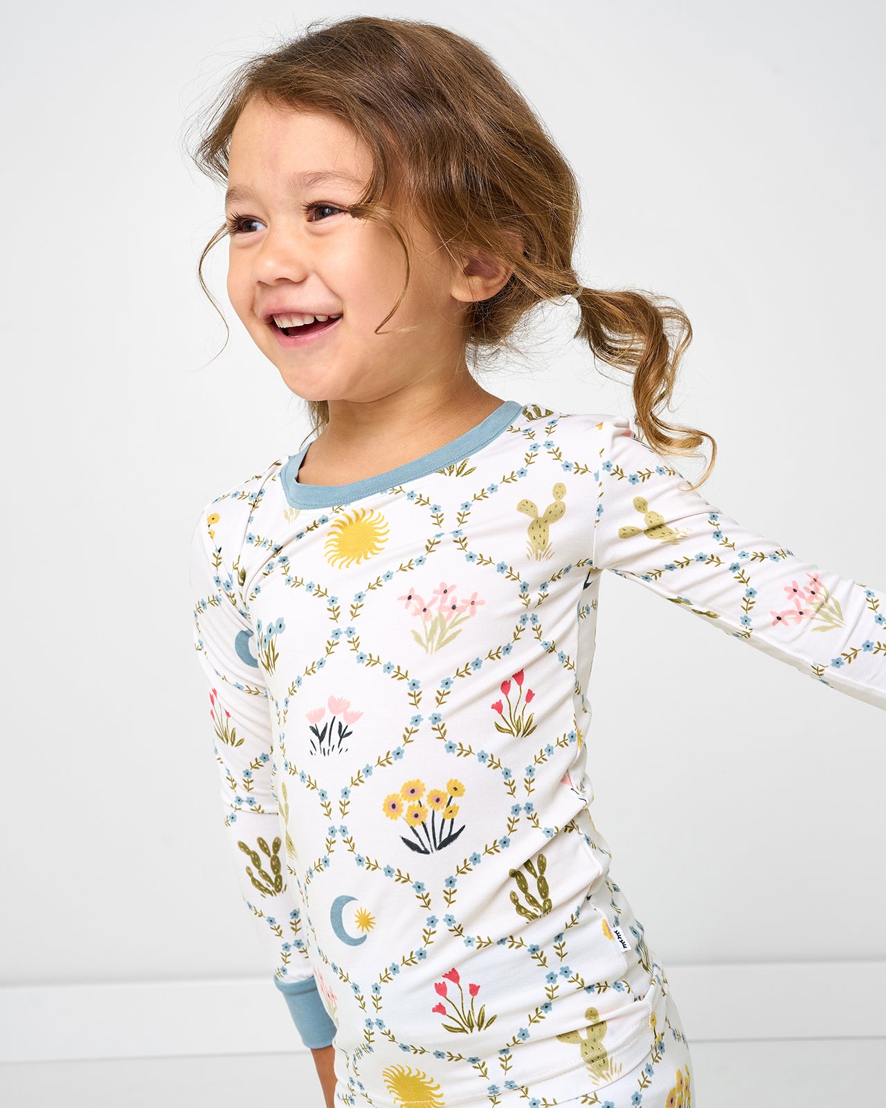 Close up of girl wearing the Desert Meadow Two-Piece Pajama Set
