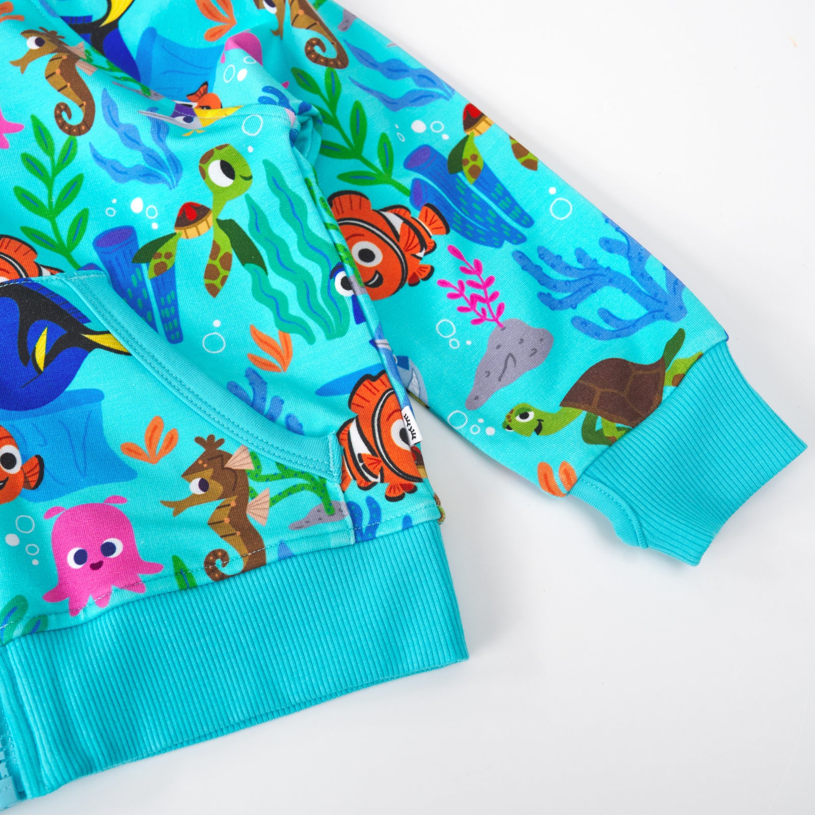 Close up of the wrist cuff detail on the Disney Nemo's Reef Zip Hoodie