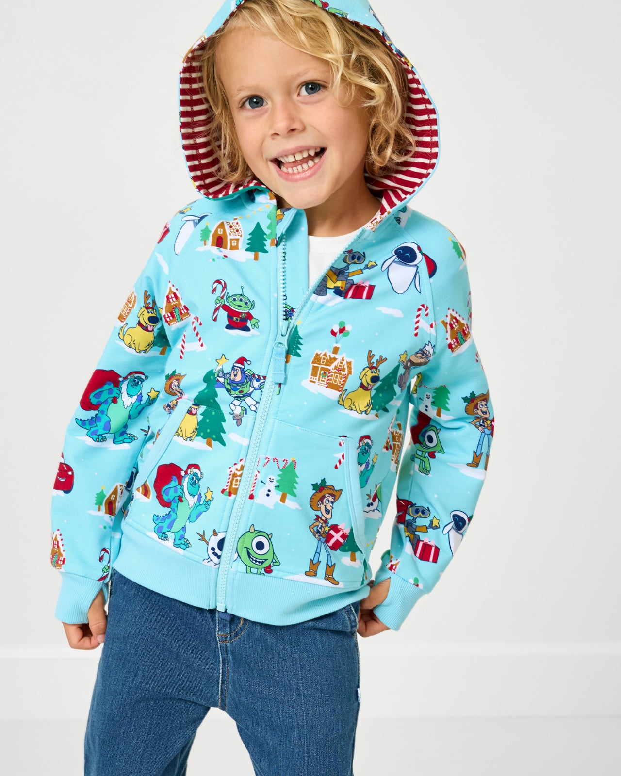 Child wearing the Disney & Pixar Christmas Village Zip Hoodie