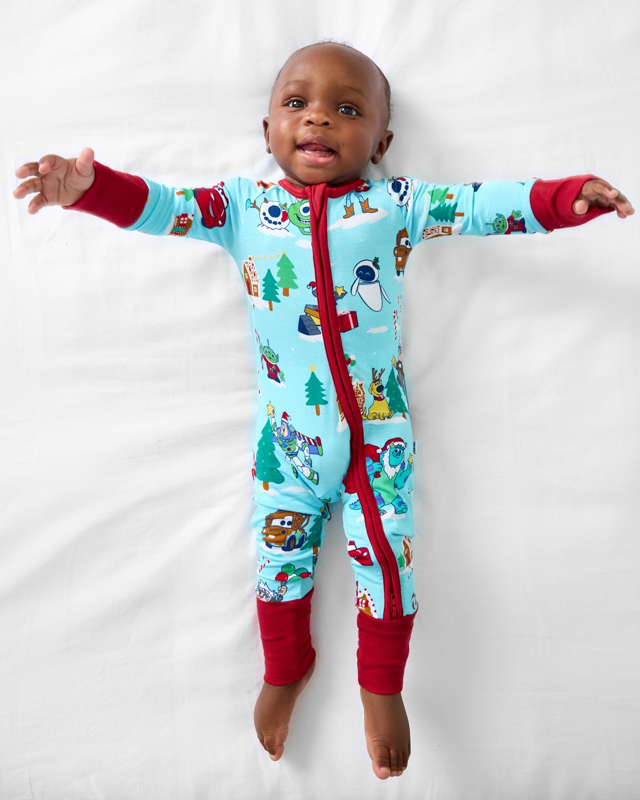 Aerial view of baby wearing the Disney & Pixar Christmas Village Zippy