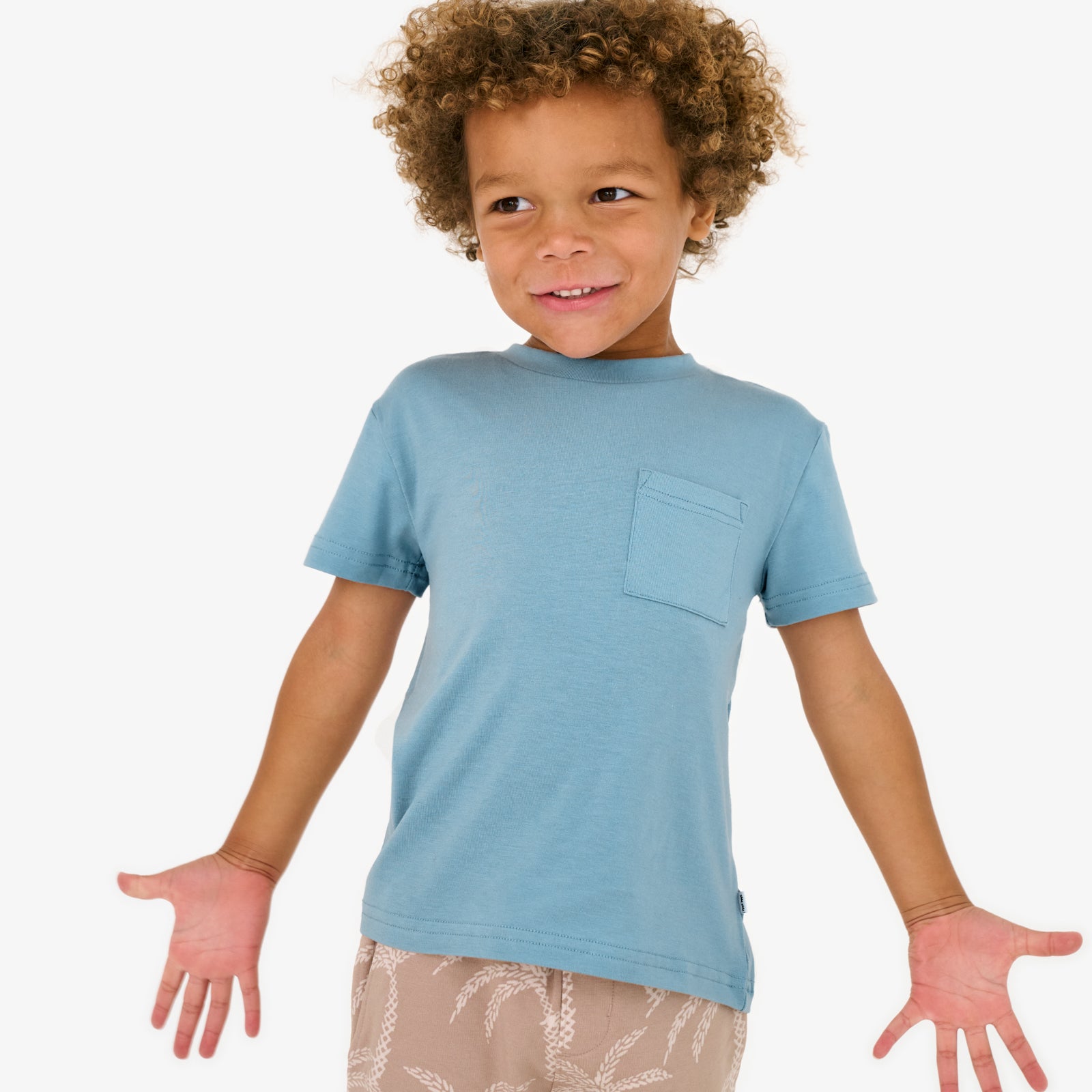 Posing child wearing the Dusk Blue Relaxed Pocket Tee