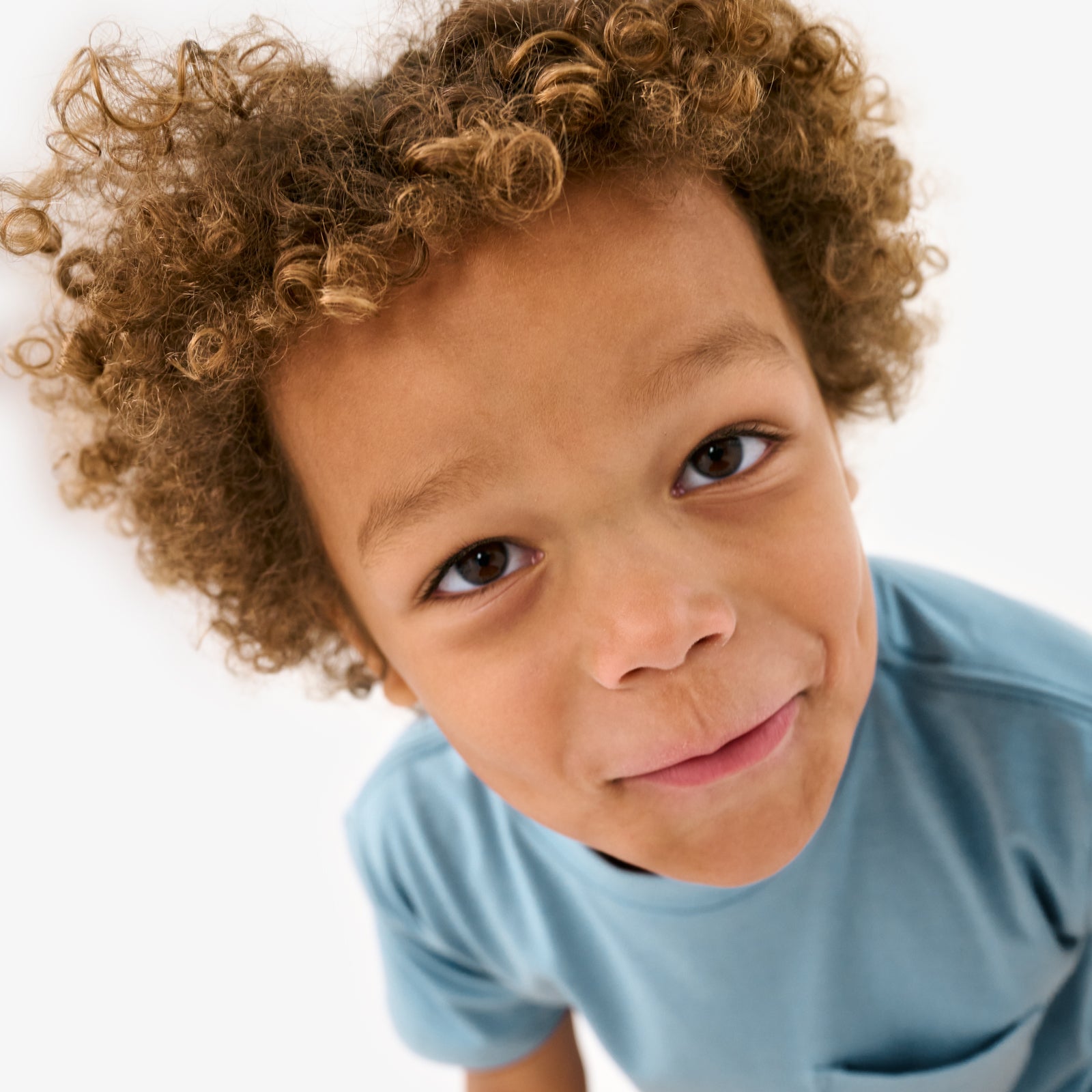 Close up of child wearing the Dusk Blue Relaxed Pocket Tee