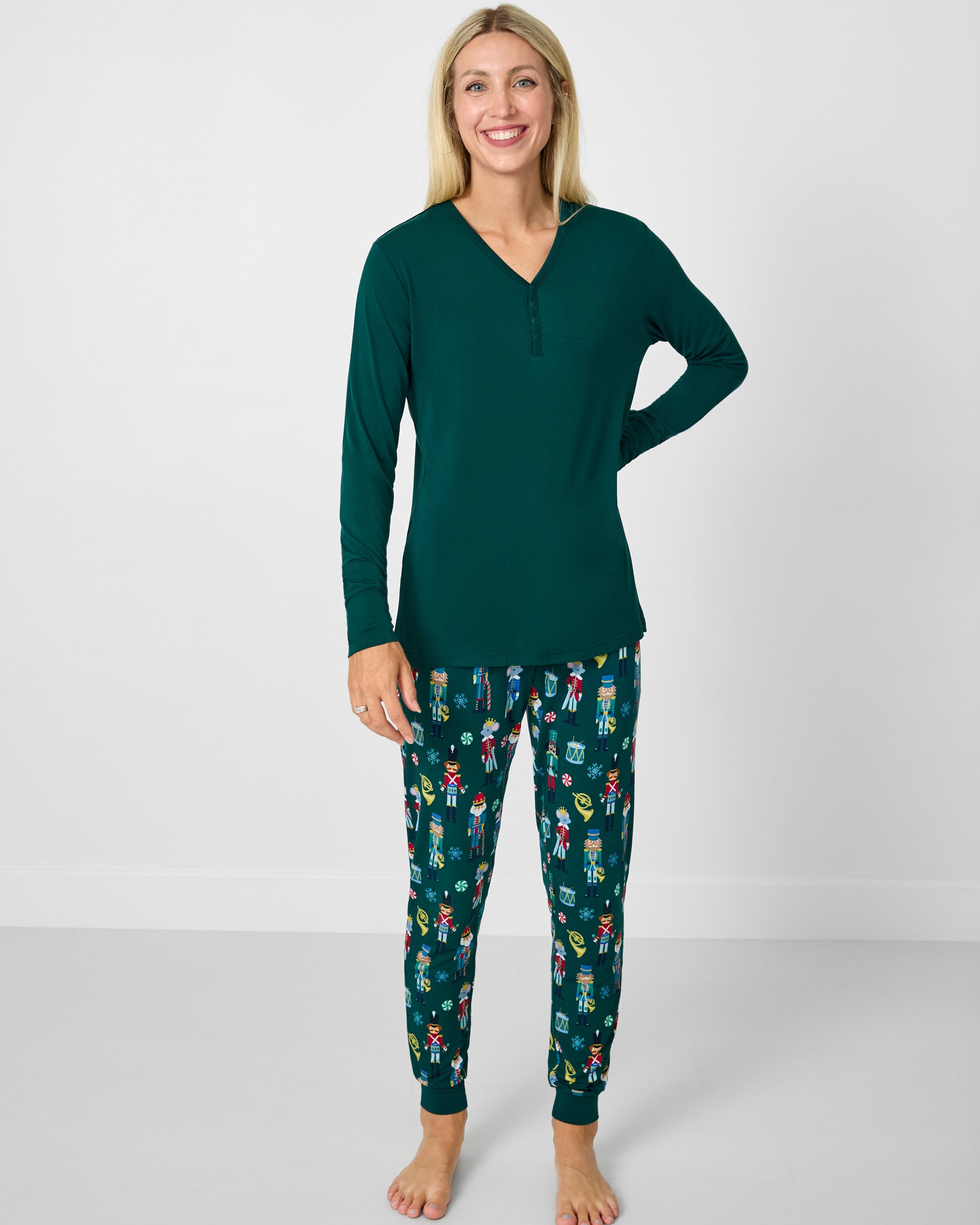 Woman wearing the Emerald Women's Long Sleeve Pajama Top with Nutcracker March pajama pants