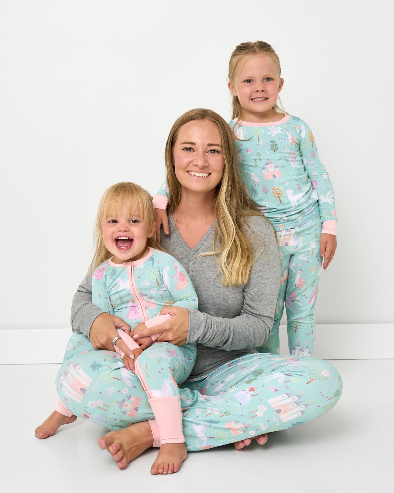 Mother and two children wearing matching Enchanted Fairytale bamboo pajamas