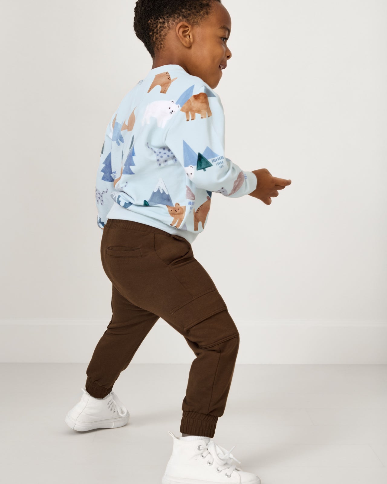 Child in motion wearing the Mocha Cargo Jogger