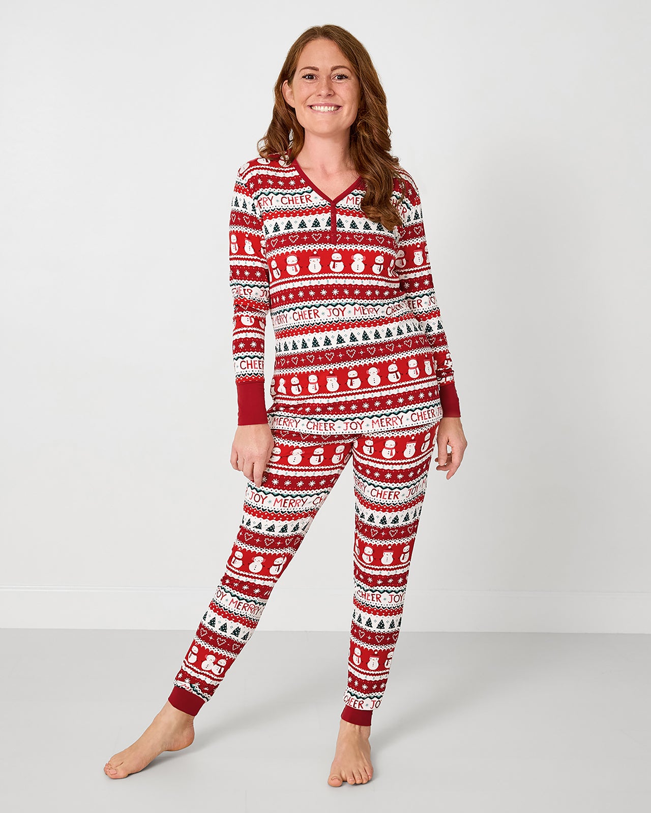 Woman wearing the Festive Fair Isle Women's Long Sleeve Pajama Top and matching pajama pants
