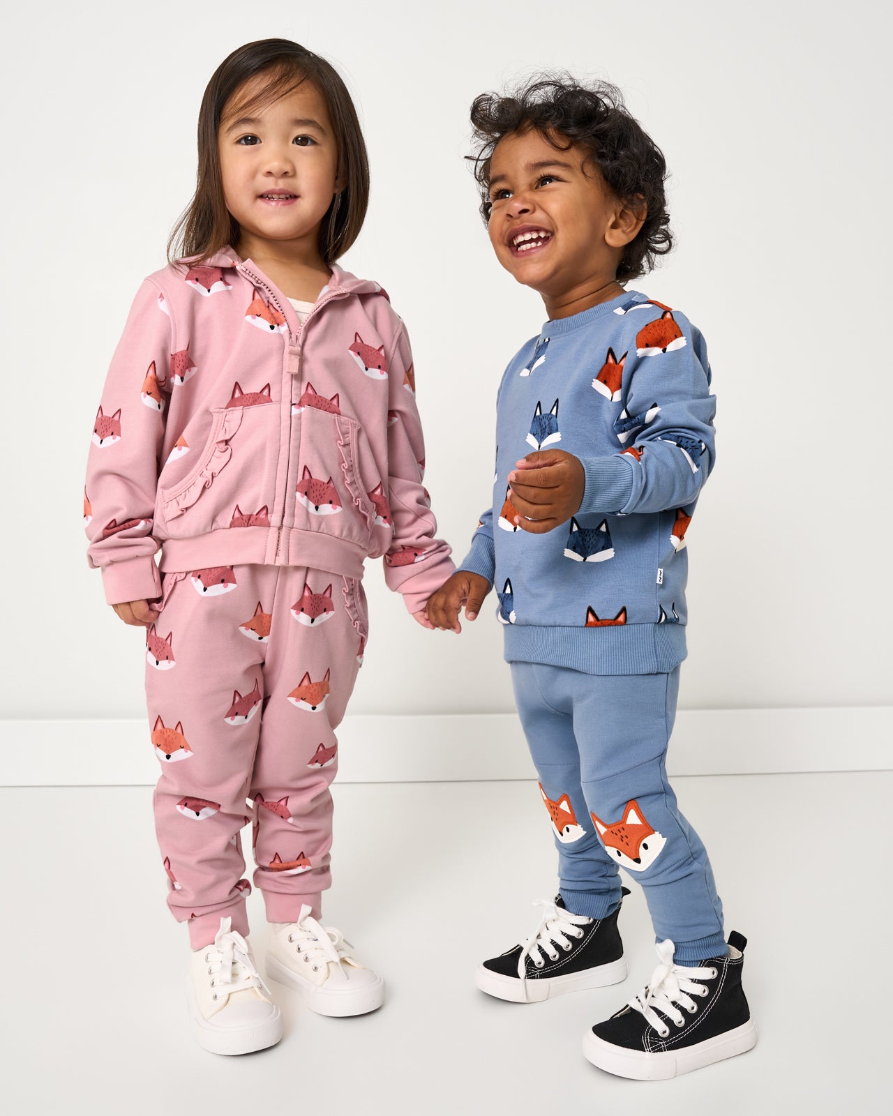 Two children wearing matching Fox Tracks styles