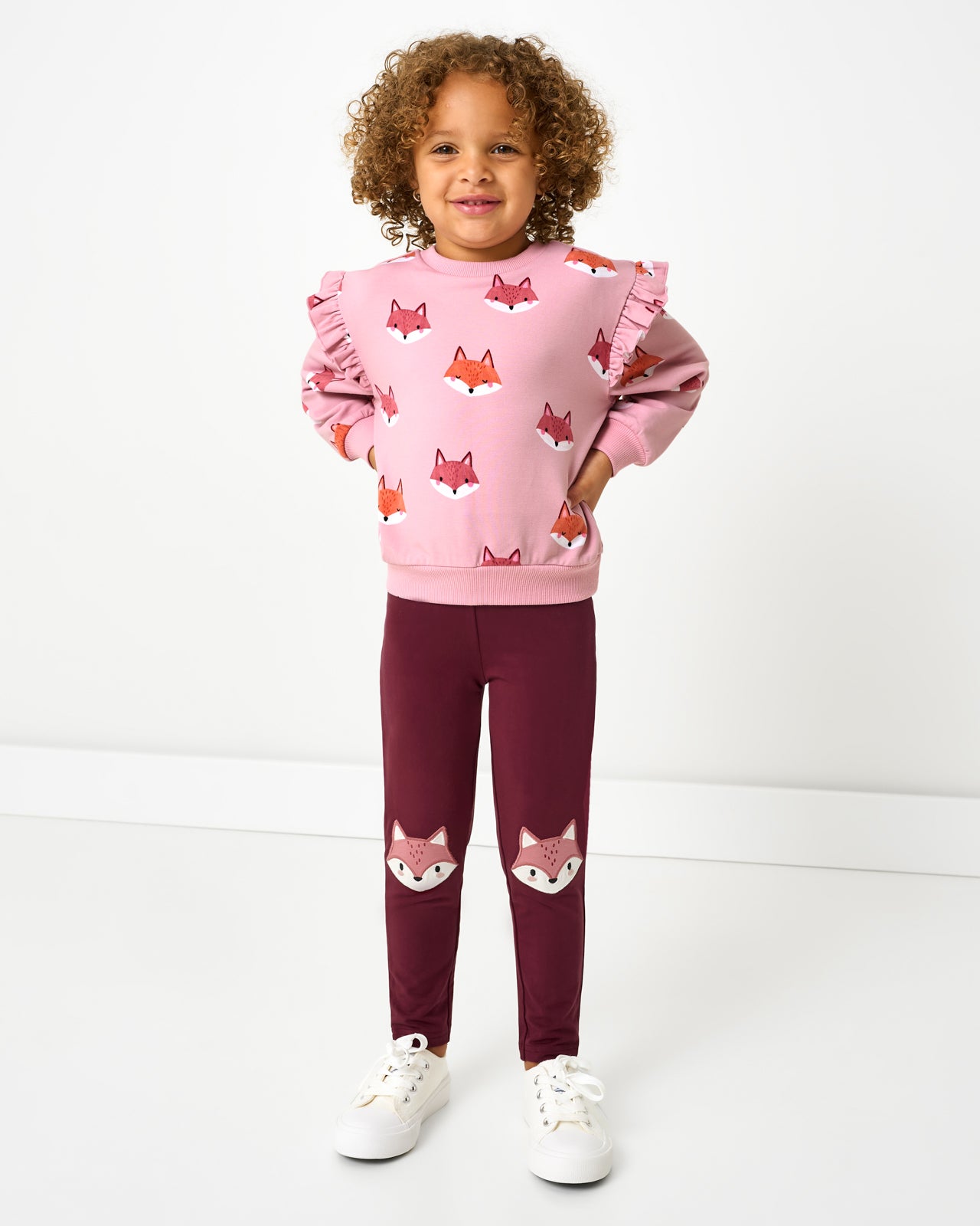 Girl wearing the Fox Knee Patch Legging with a coordinating crewneck