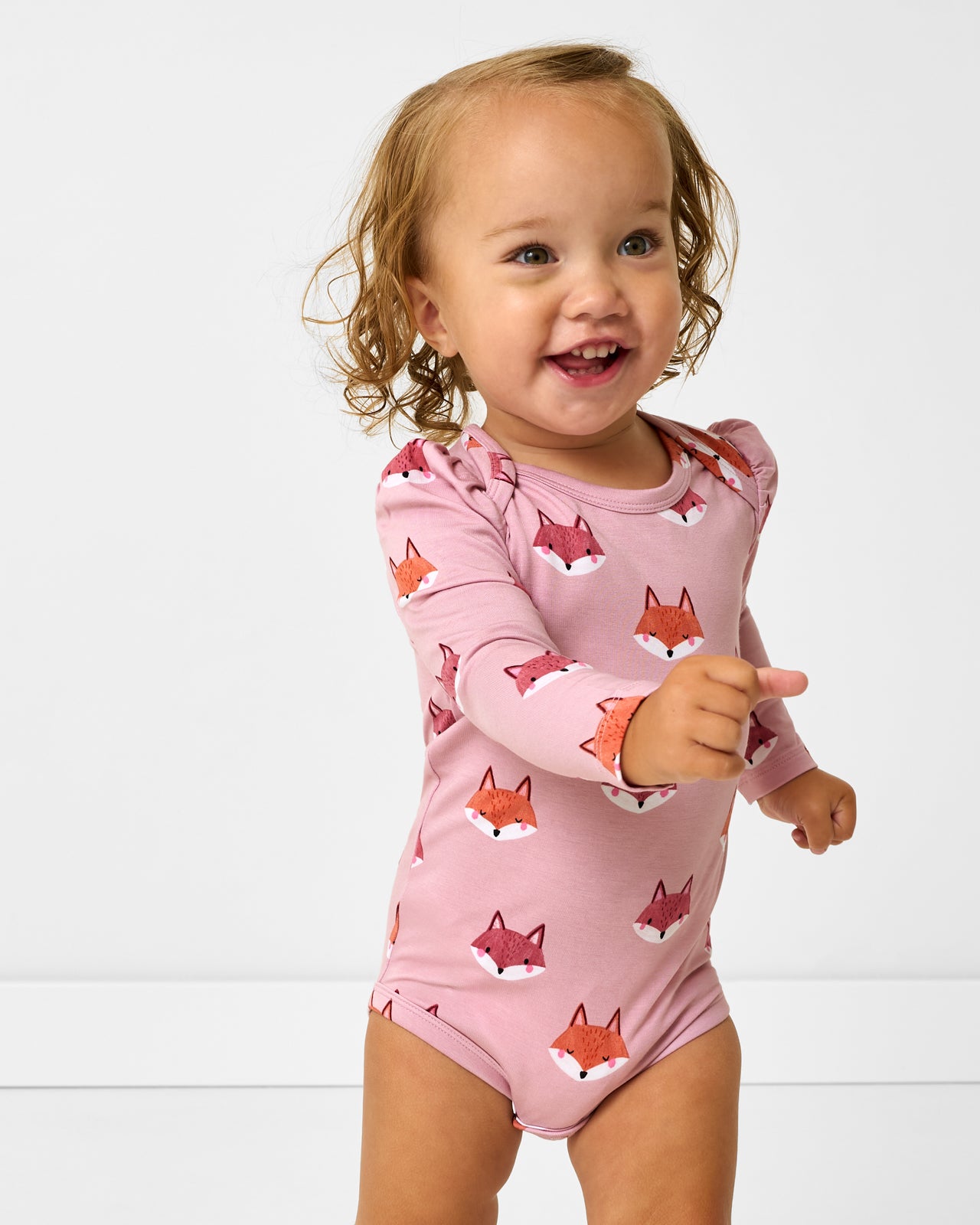 Close up of toddler wearing the Fox Tracks Puff Sleeve Bodysuit