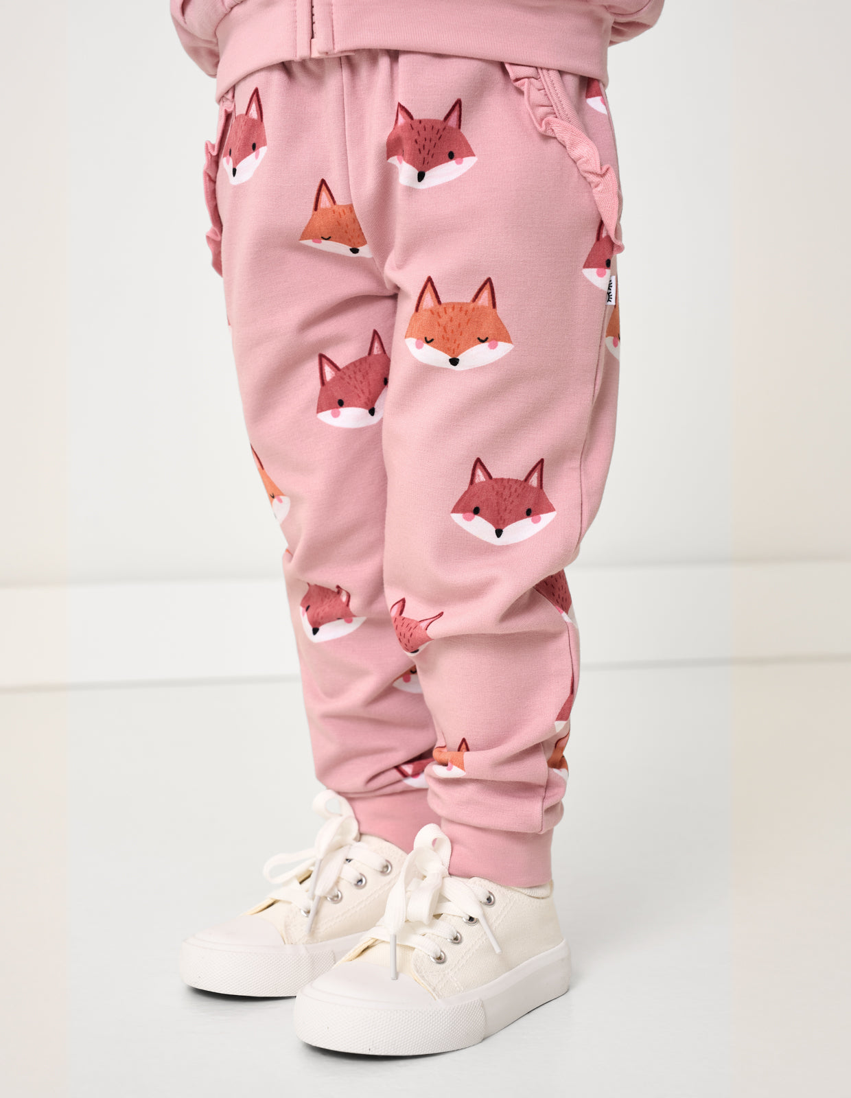 Girl wearing the Fox Tracks Ruffle Jogger