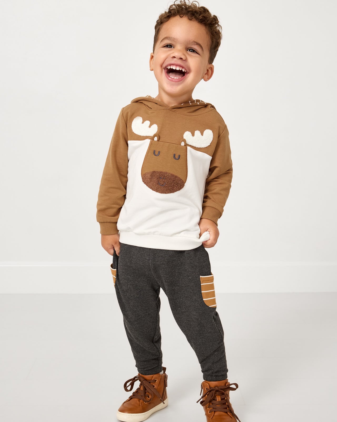 Boy wearing the Moose Pullover Hoodie with Heather Black joggers