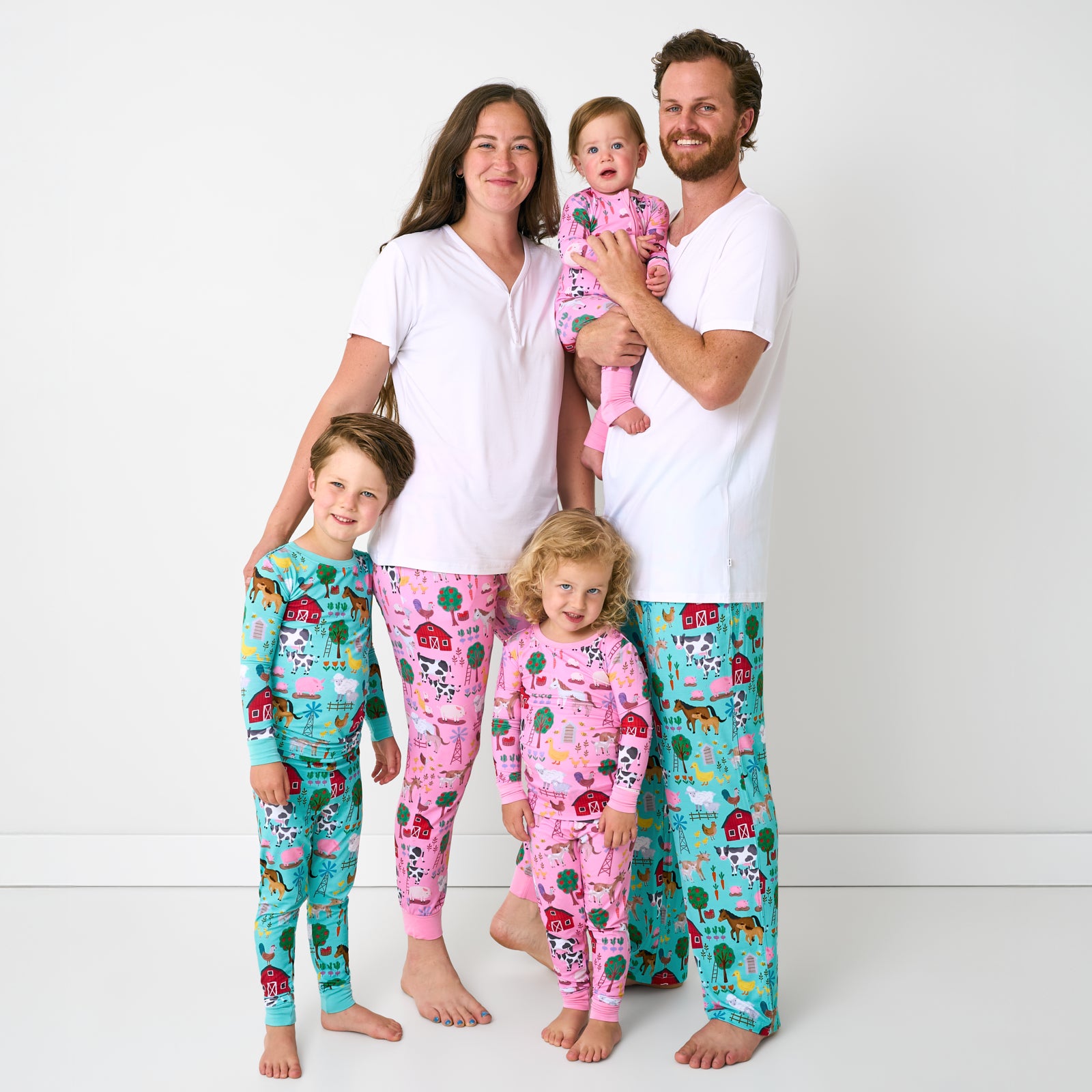 Family of five wearing matching Farm Fam bamboo pjs for family matching