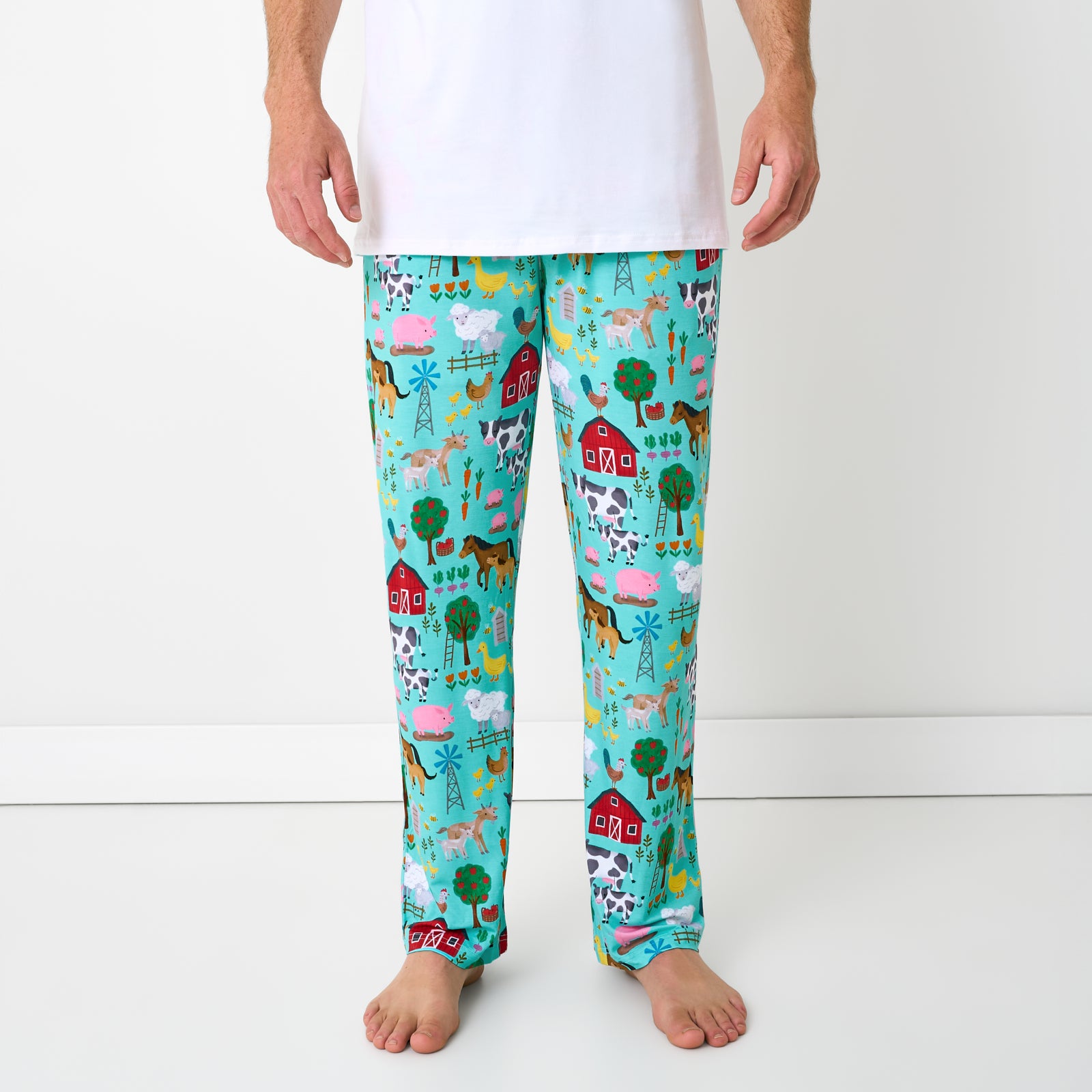 Front view of man wearing the Turquoise Farm Fam Men's Pajama Pants