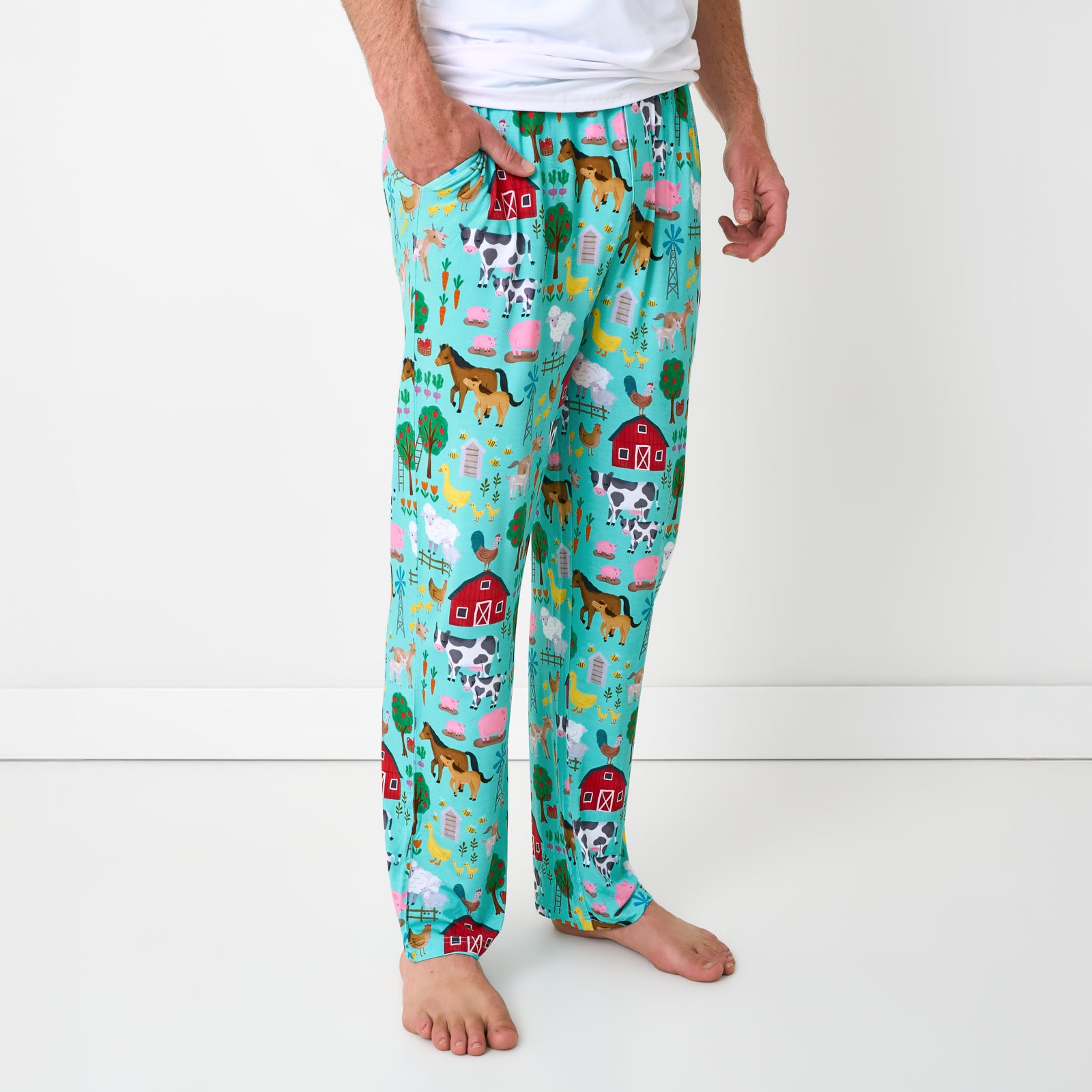 Side view of man wearing the Turquoise Farm Fam Men's Pajama Pants