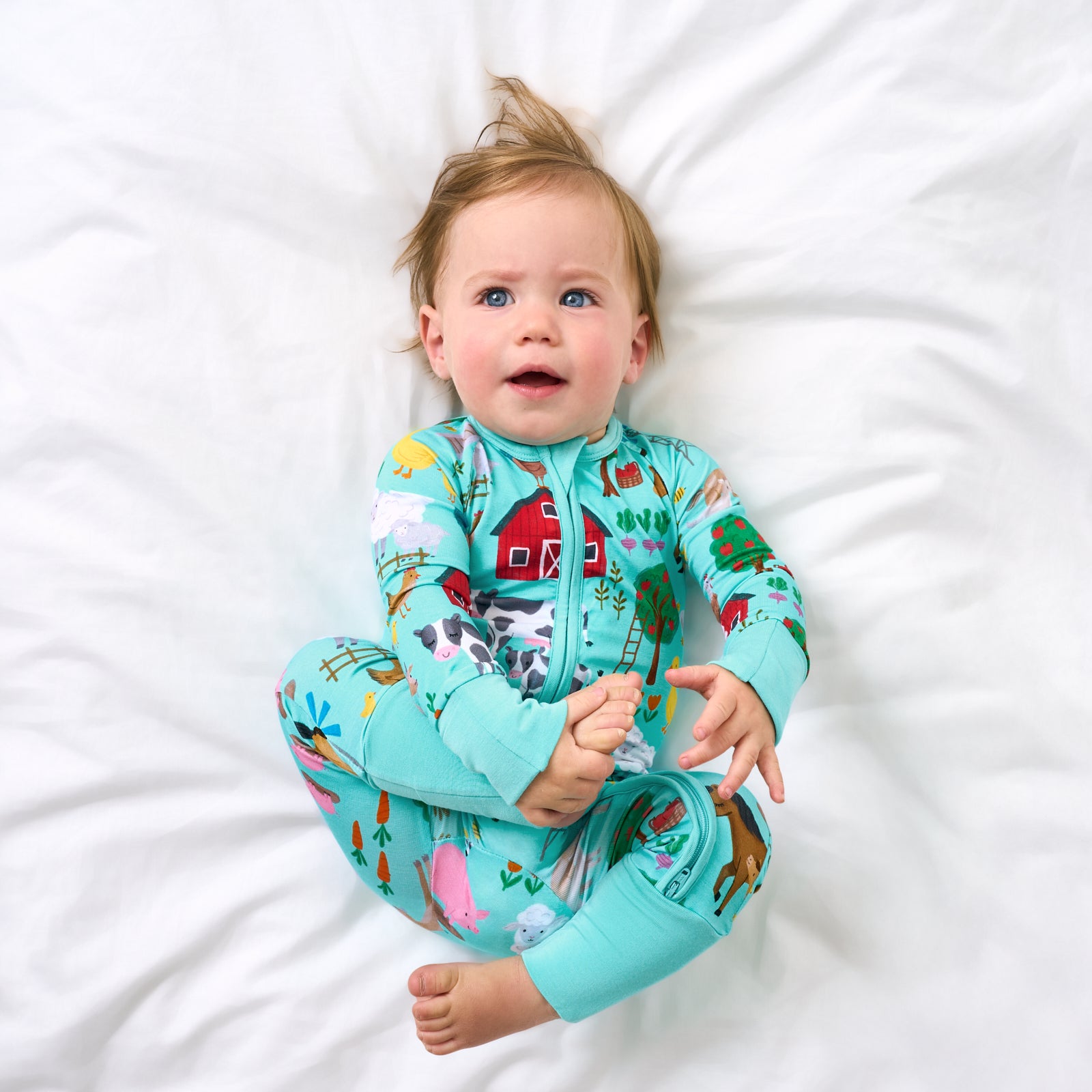 Aerial view of child wearing the Turquoise Farm Fam Zippy