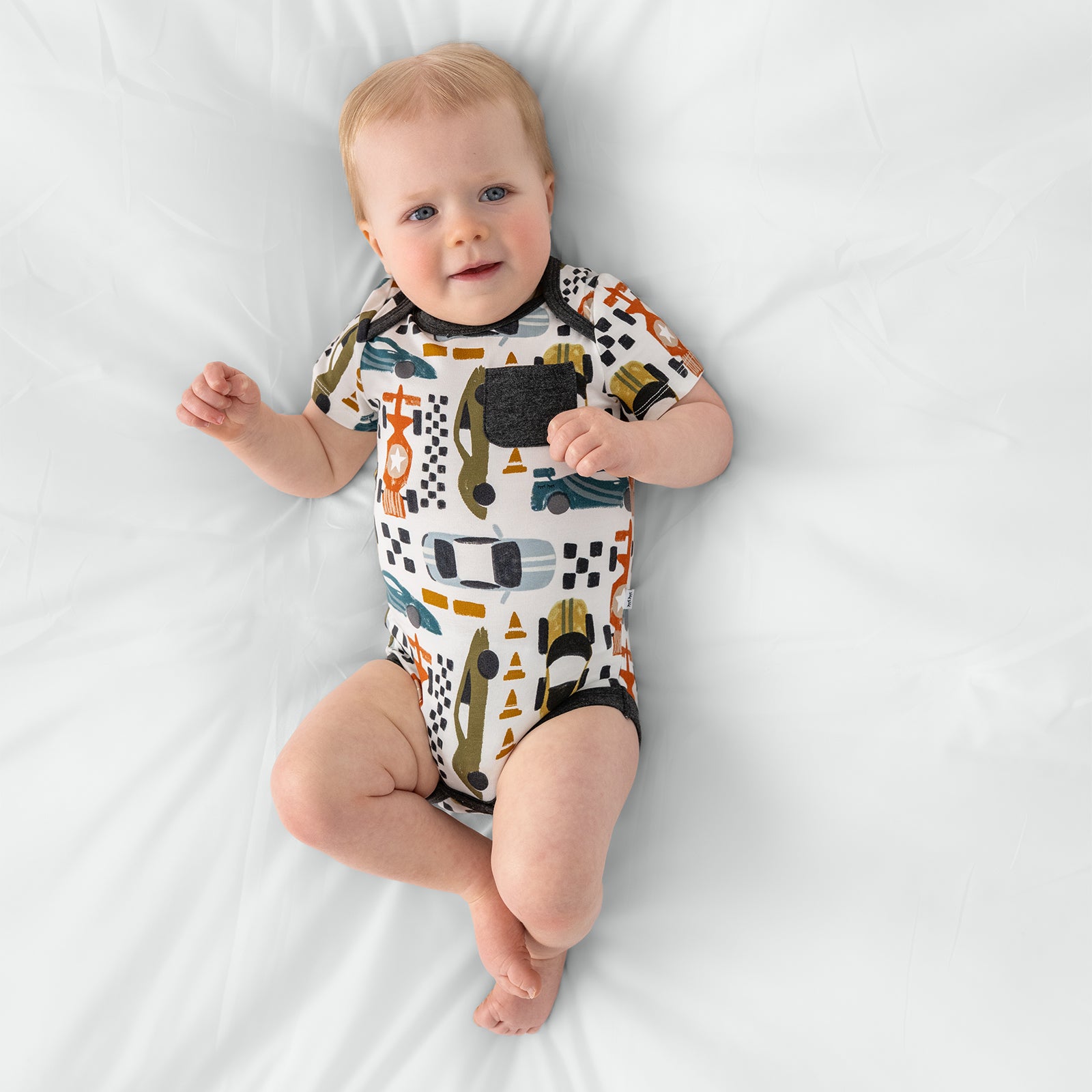 Alternate arial view of child in the Fast Lane Pocket Bodysuit